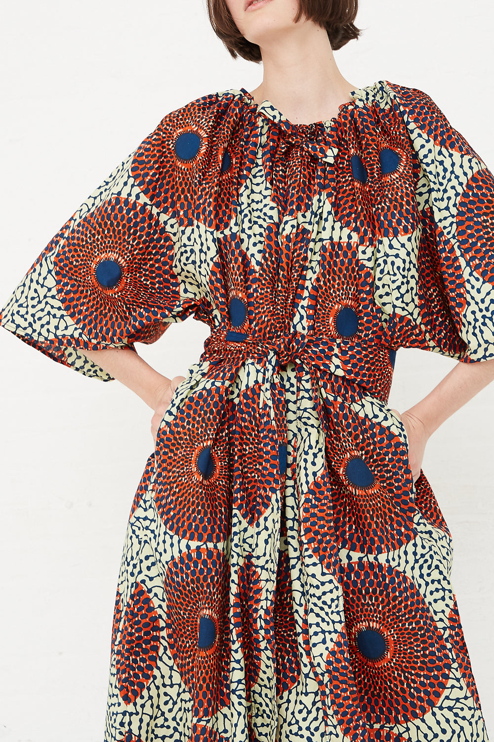 Odile Jacobs - Arabelle Dress in Rust Circles front detail with self tie belt
