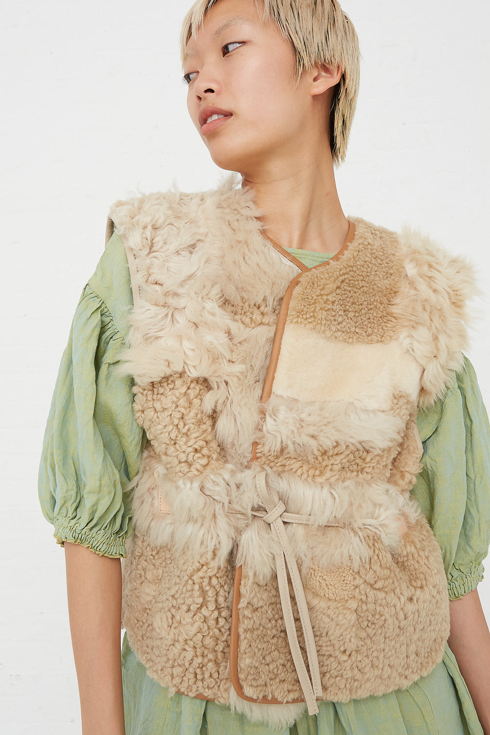 Milena Silvano - Sheepskin Transition Vest Patchwork Multi B front view with belt tied