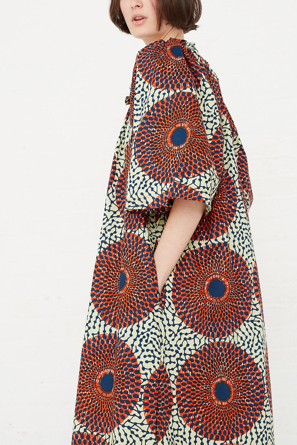Odile Jacobs - Arabelle Dress in Rust Circles hand in pocket side detail