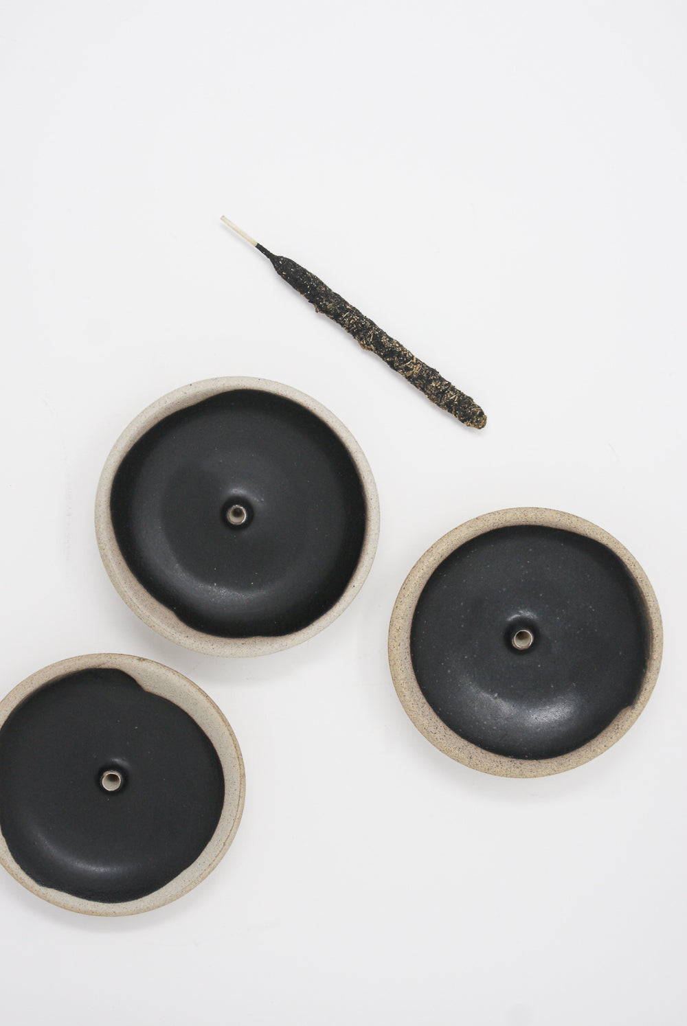 Incausa - Stoneware Incense Holder in Black group view with incense