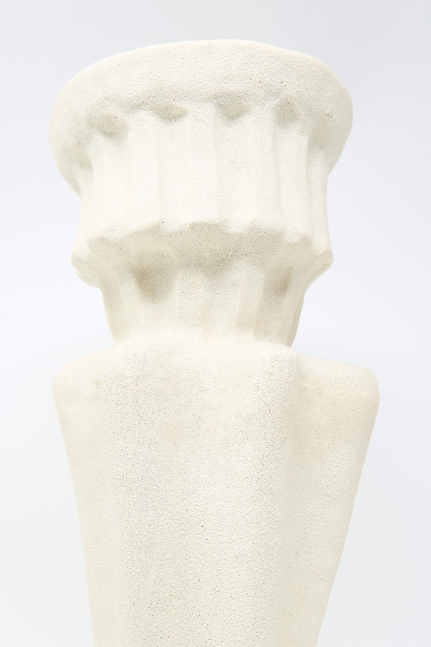 Close-up view of the ANK Ceramics Column Vessel in White, a textured stoneware piece with a fluted design, against a light background.