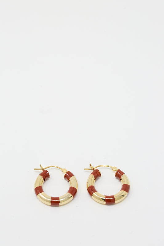 A pair of Abby Carnevale Vermeil Striped Hoops in Red, handmade in NYC, displayed on a plain white background.
