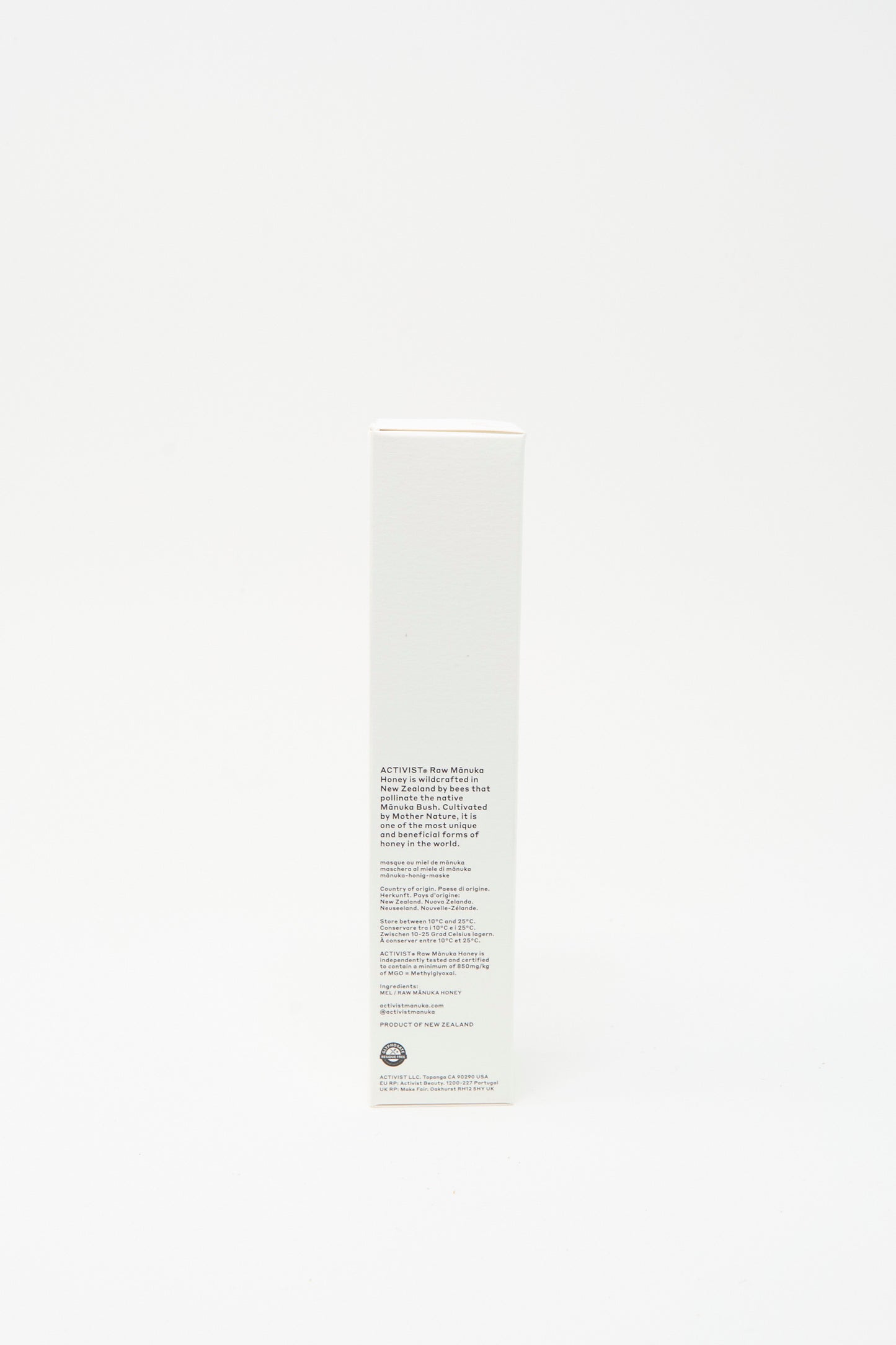 A tall, rectangular white box stands upright against a plain background, featuring printed text and the Activist logo—ideal for highlighting the Activist Mānuka Honey Mask that supports natural skin healing.