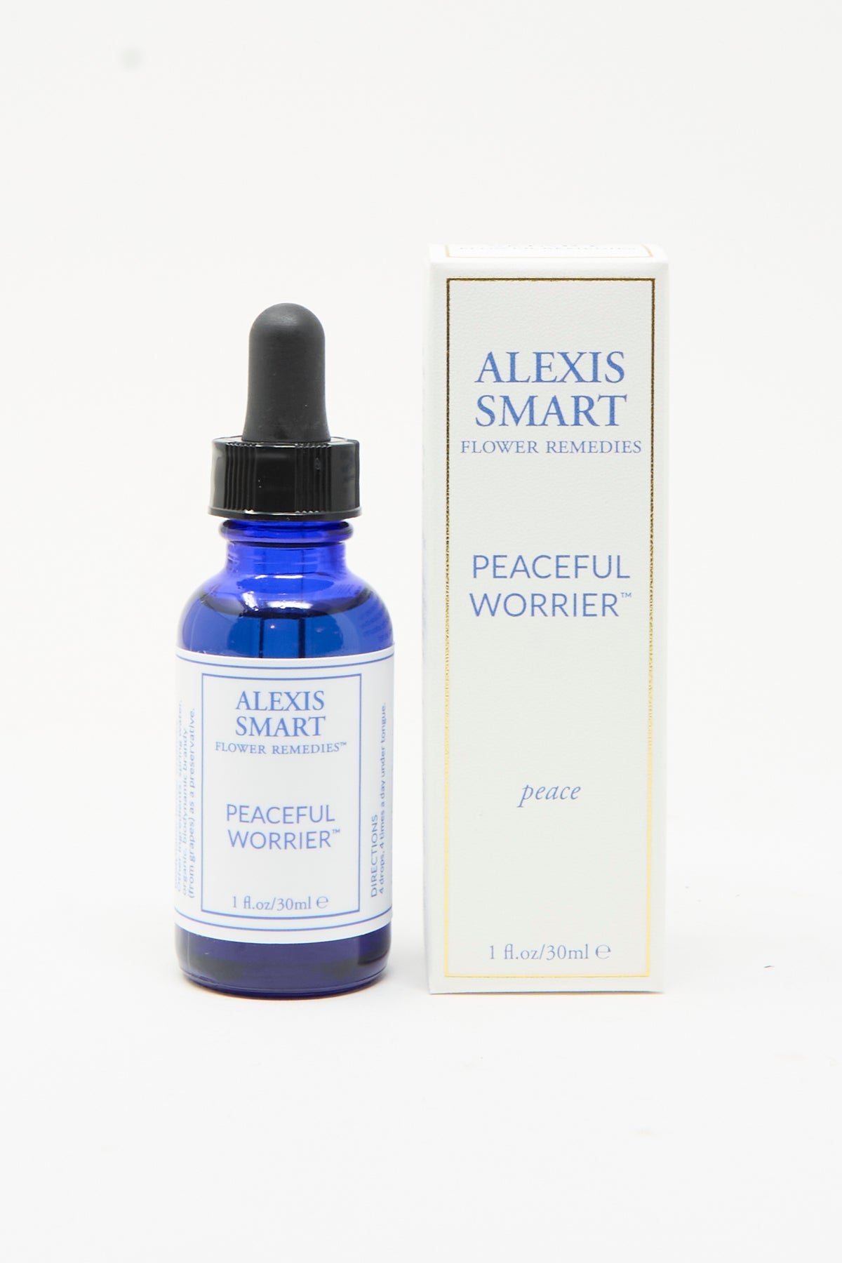 A blue glass dropper bottle and matching white box labeled Alexis Smart Flower Remedies Peaceful Worrier, an organic flower essence for stress relief.