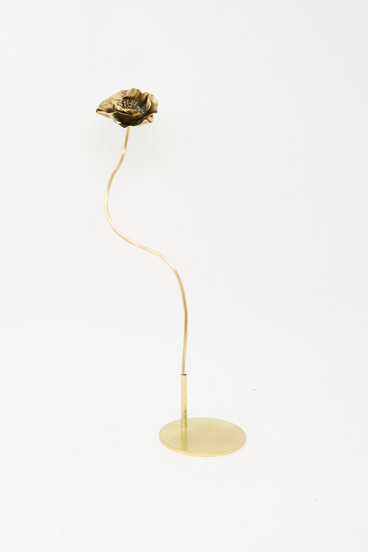 A handmade Sterling Silver and Brass Papaver No. 7 - II decorative metal flower sculpture on a thin, curved stem with a circular base.