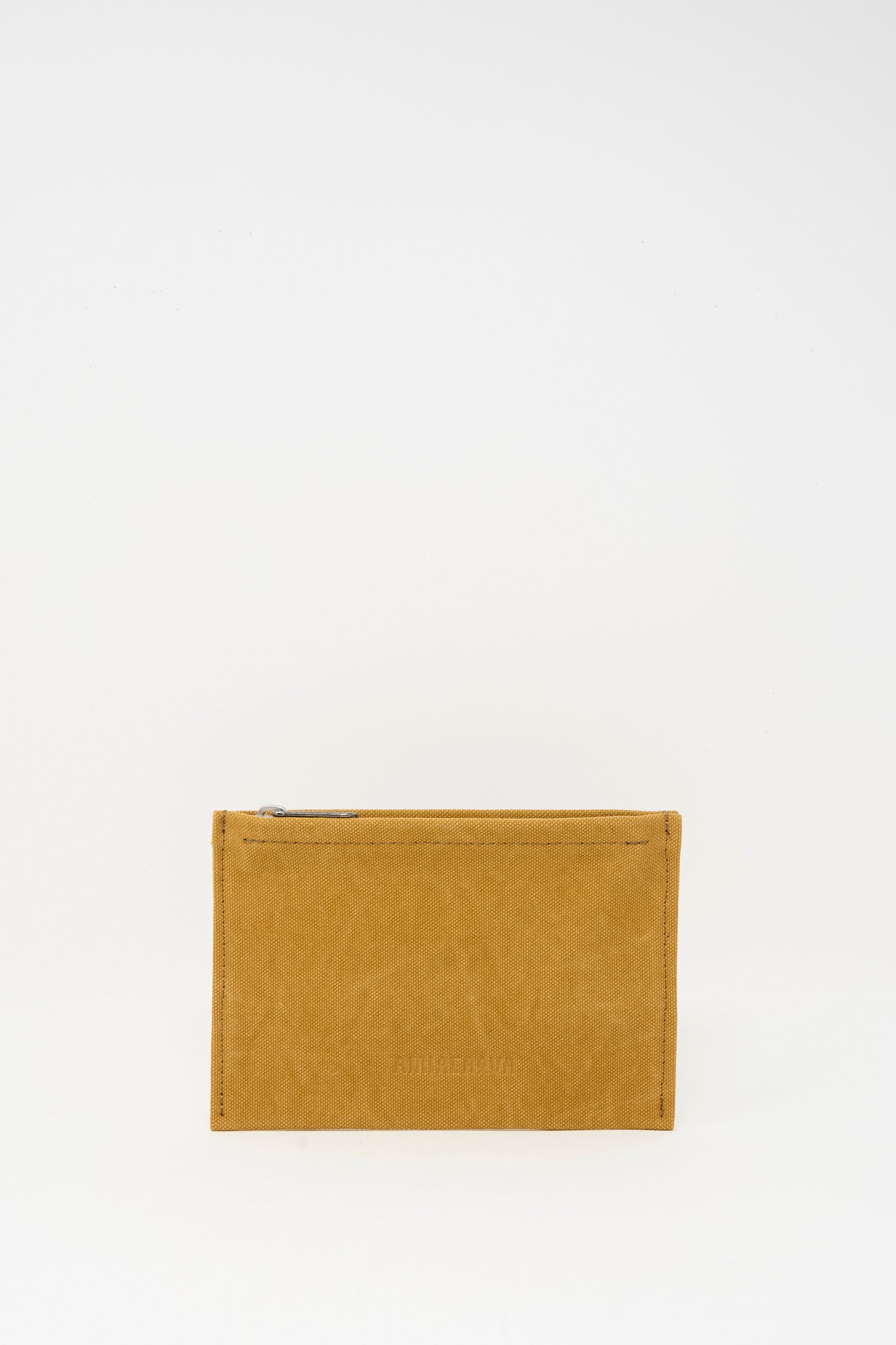 The Amiacalva Washed Canvas Medium Pouch in Mustard is a small, rectangular pouch with a top zipper, shown upright against a plain white background.