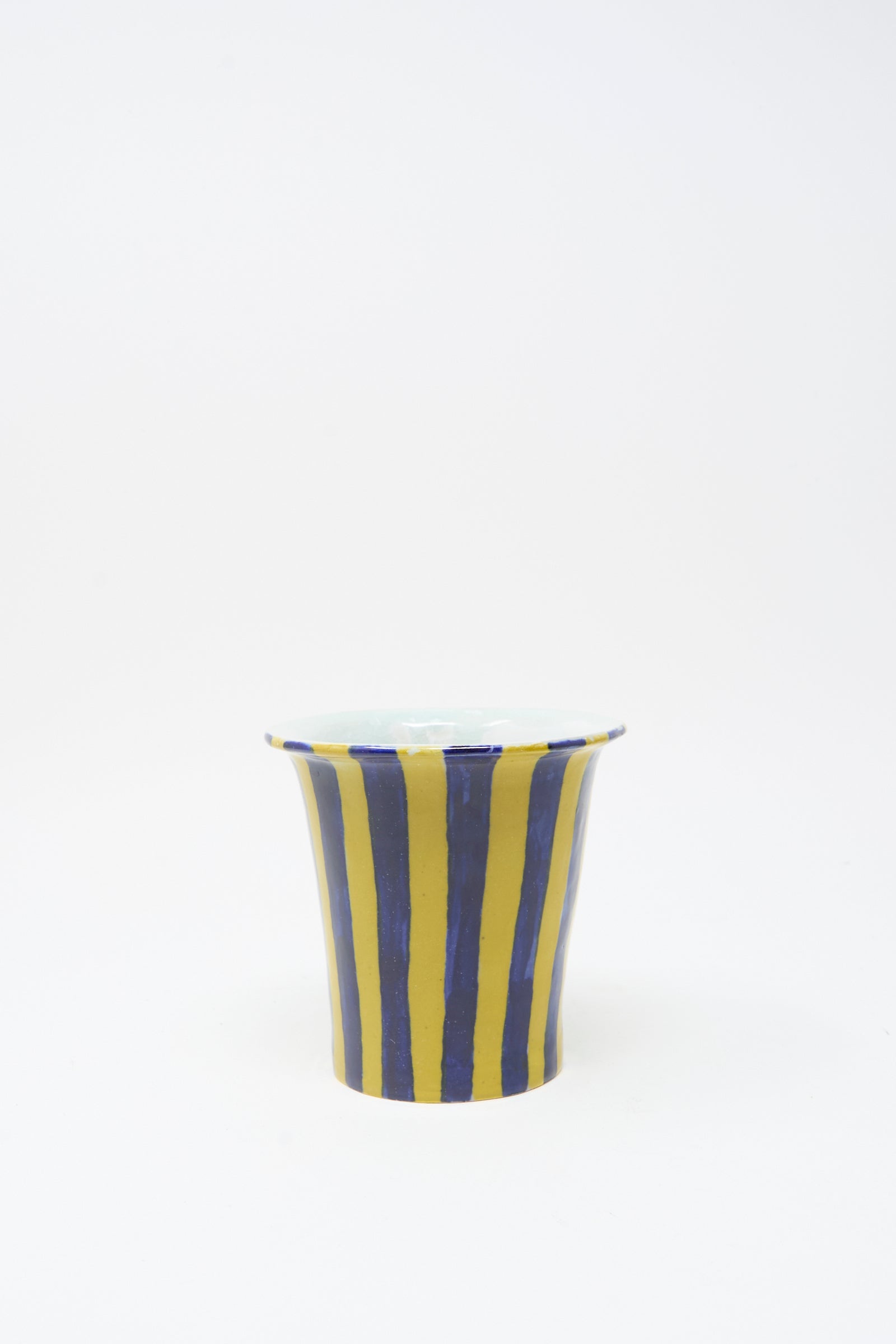 The Ariel Clute Hand Painted Floral Vessel is a handmade ceramic cup, crafted in California and set against a plain white background.