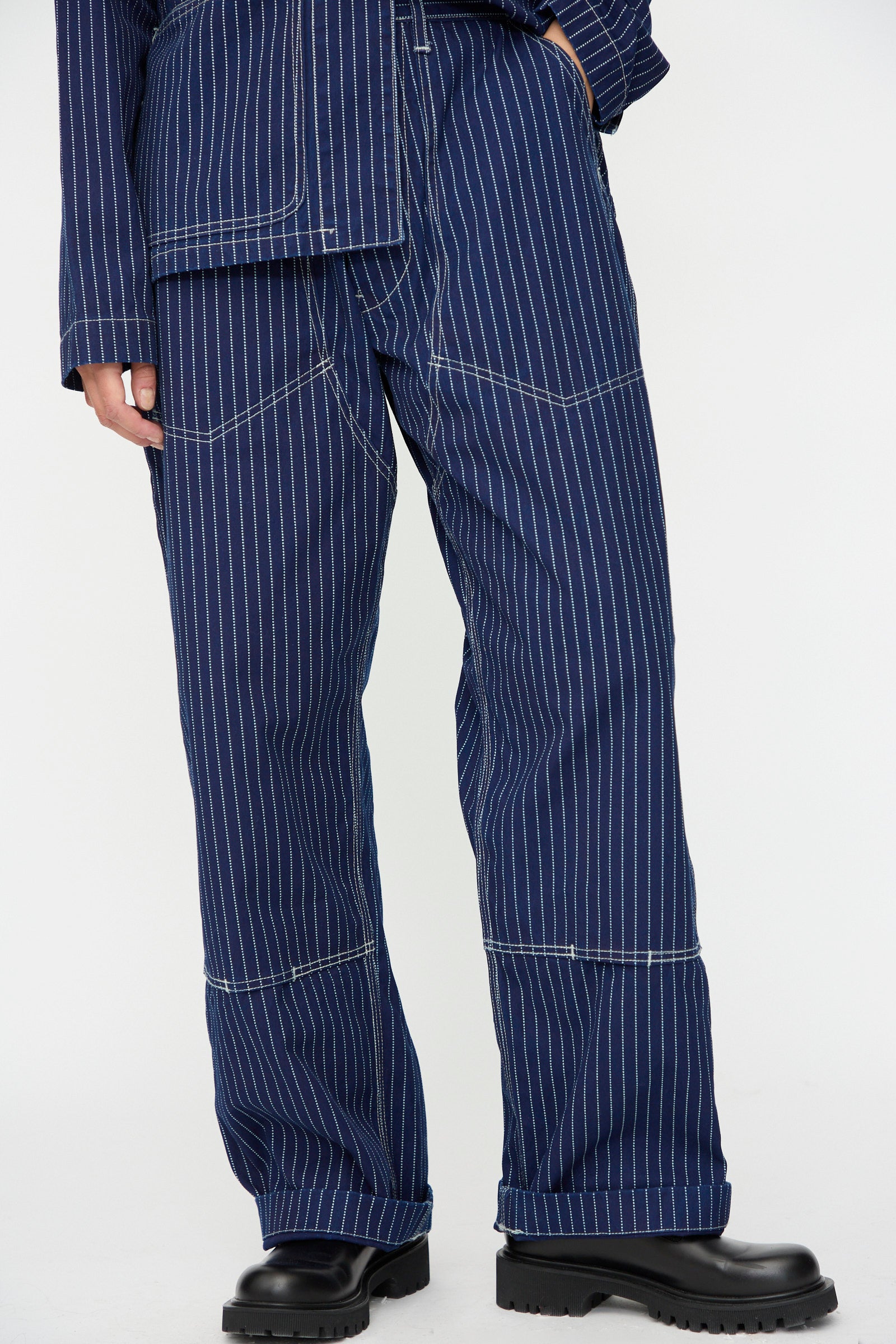 Wearing the As Ever Henri Pant in Wabash with a matching top featuring white stitching, styled with black chunky boots.