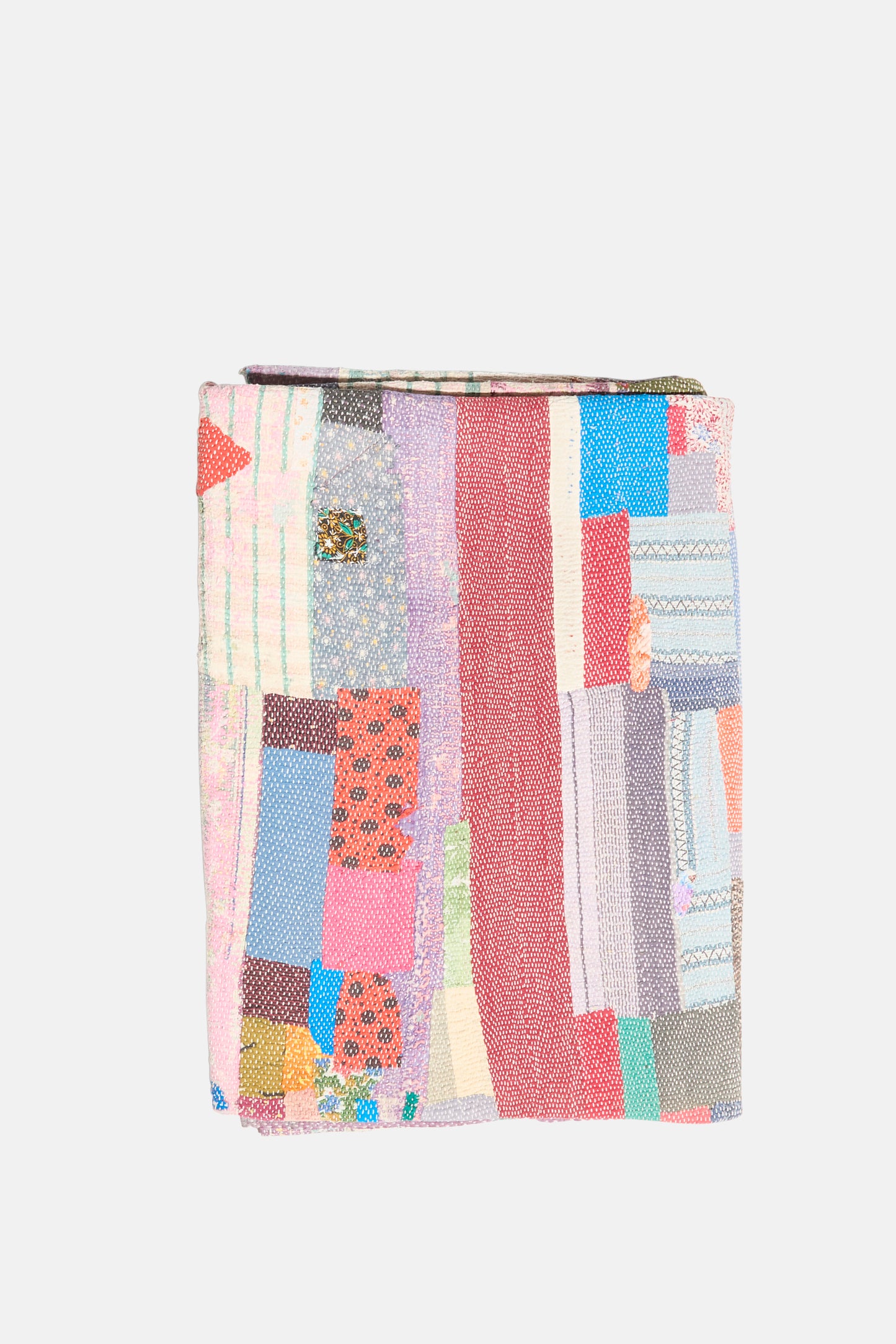 The One of a Kind Vintage Kantha Quilt I by Auntie Oti is a handmade blanket crafted from upcycled cotton, featuring a folded patchwork of vibrant, patterned fabrics for a unique and sustainable touch.