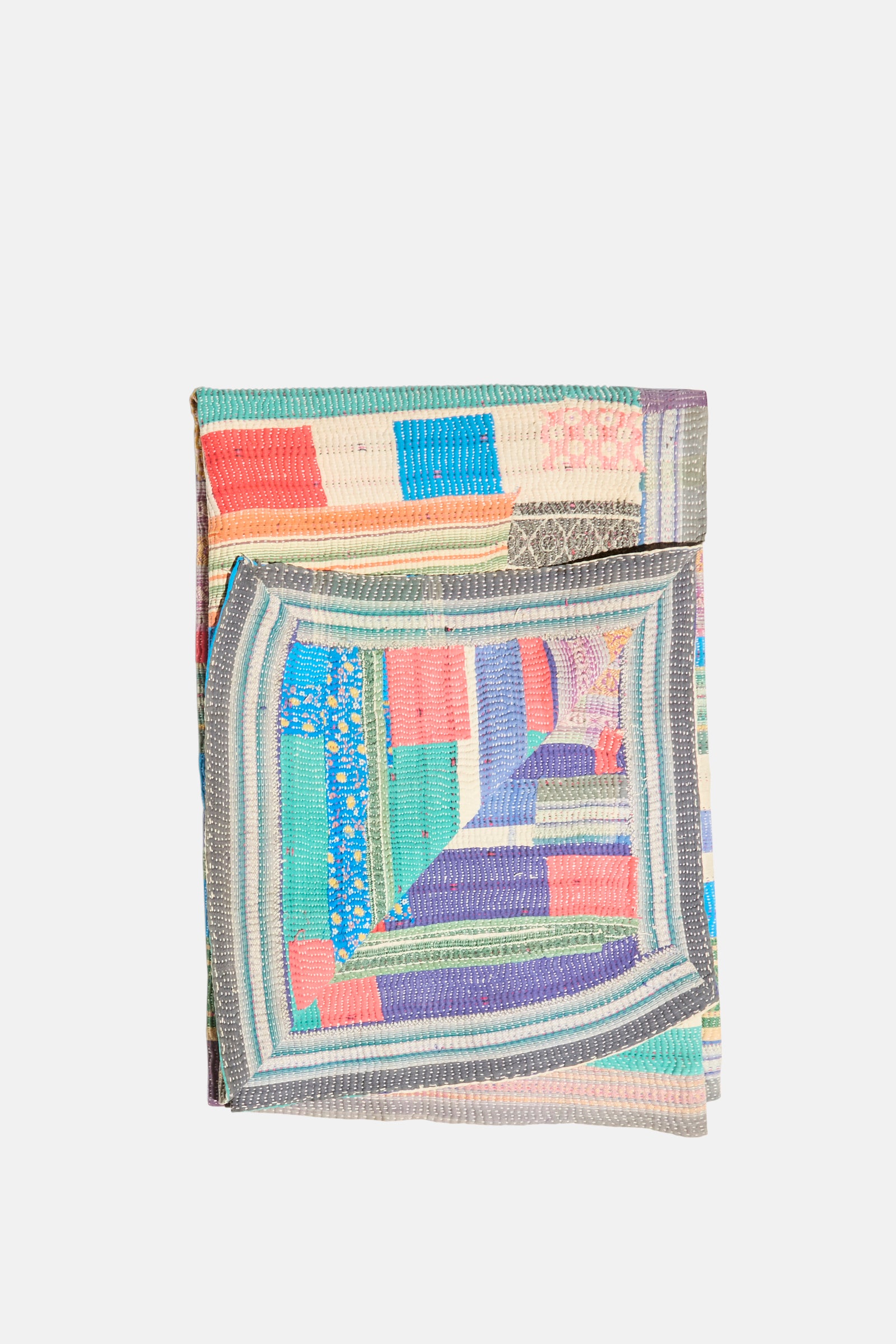 The One of a Kind Vintage Kantha Quilt II by Auntie Oti, featuring upcycled cotton with blue, pink, green, and beige geometric patchwork, is displayed folded against a white background.