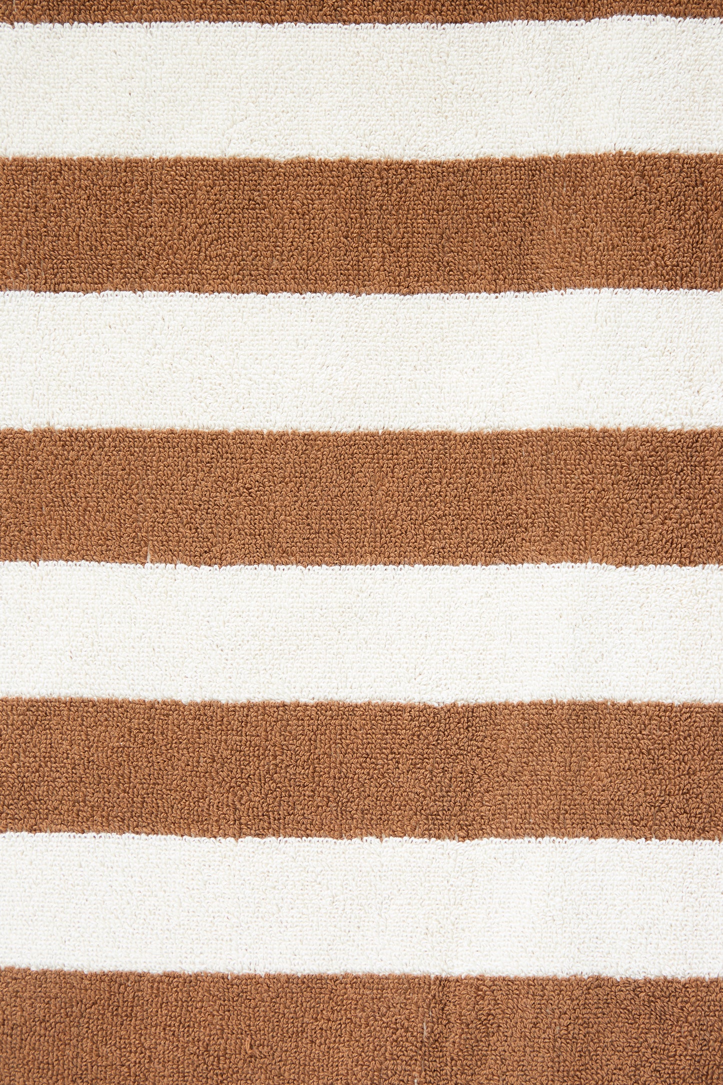 Close-up of an oversized Maria Pool Towel made with organic cotton, featuring alternating horizontal brown and white stripes by Autumn Sonata.