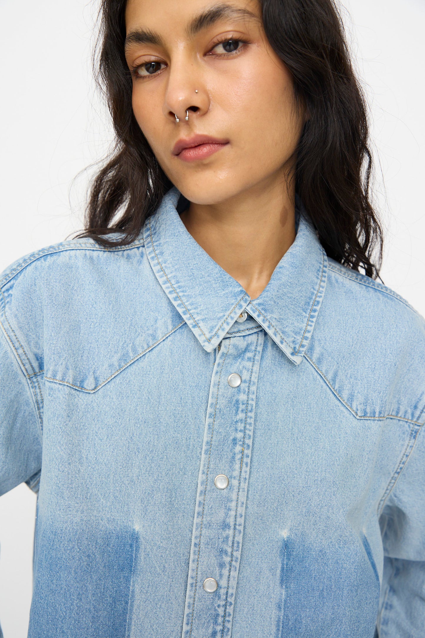 A person with long dark hair and a nose ring wears the B Sides Liv Western Shirt in Park Wash, looking directly at the camera against a plain background.