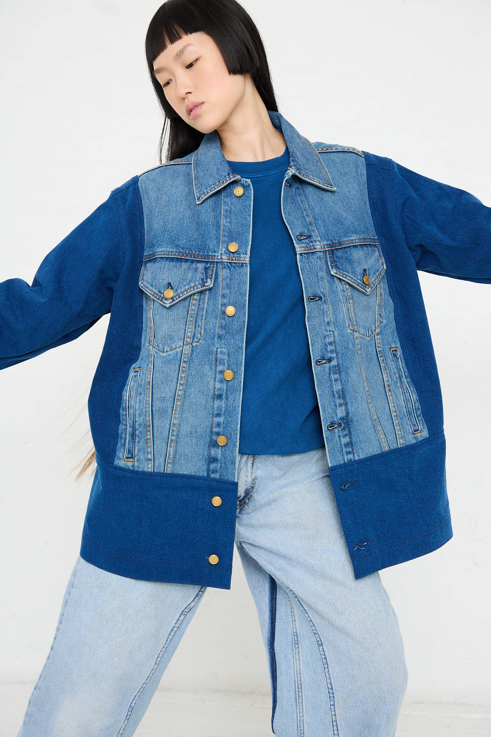 Person wearing a blue sweater, the Reworked Barn Jacket in Quincy Blue by B Sides, and matching light blue jeans against a plain background.