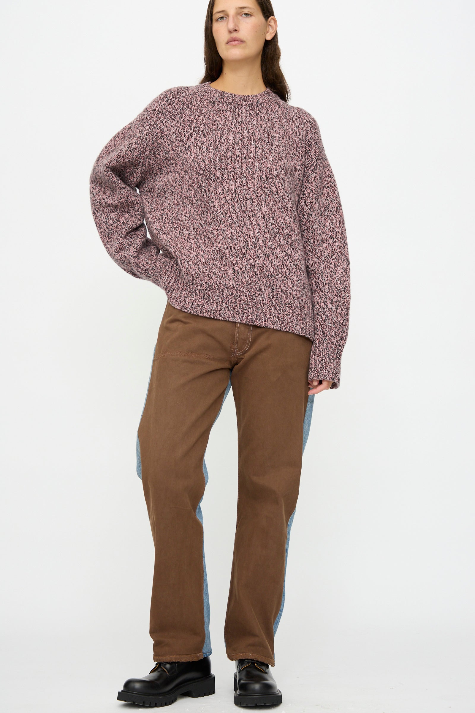 A person wears maroon speckled sweater, black shoes, and B Sides' Vintage Straight Rework Halfsie in Brown and Indigo, standing against a plain white background.