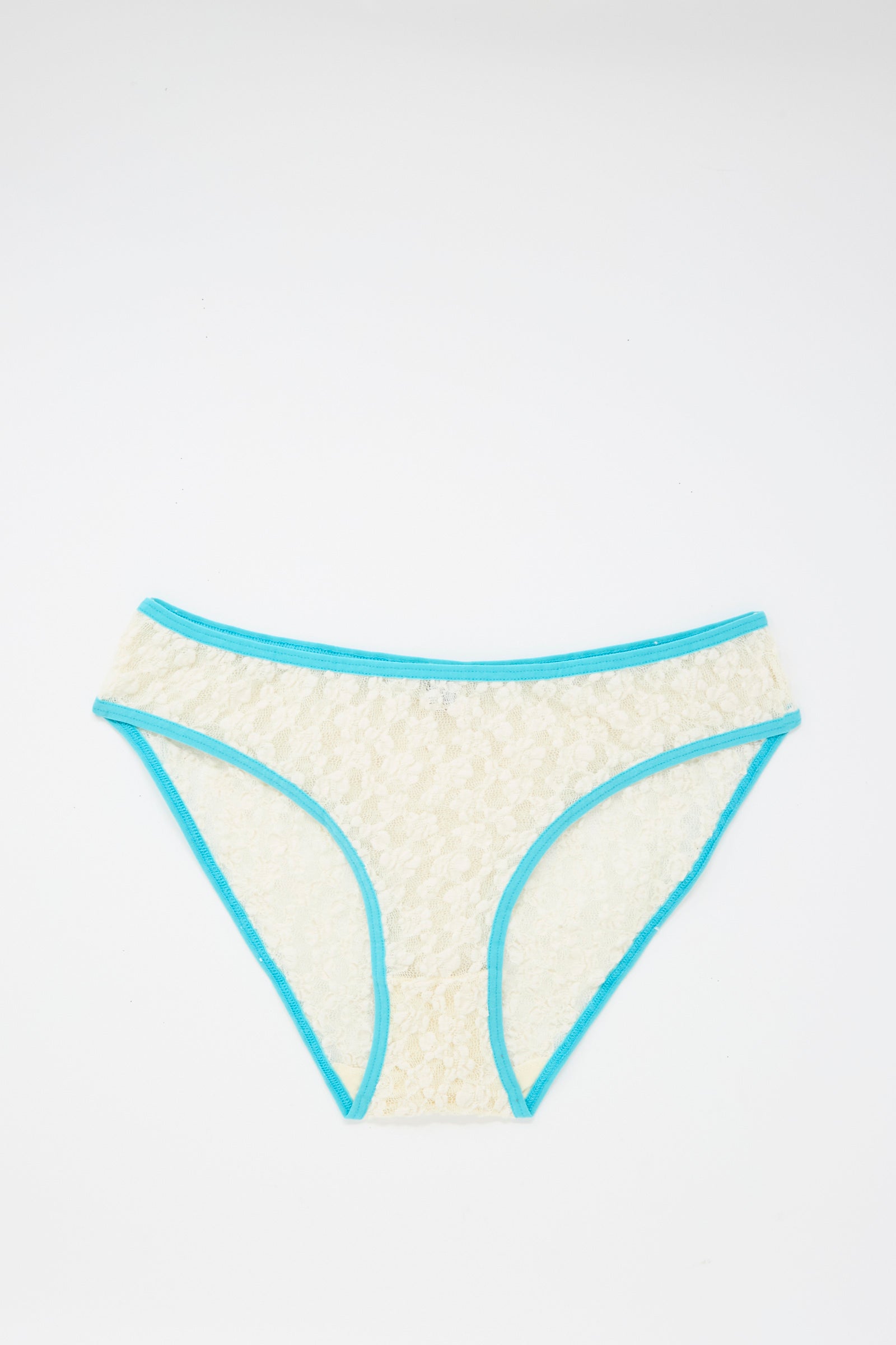 The Baserange Cotton Lace Musial Pant, a cream low-rise under-pant with turquoise elastic trim made from organic cotton, is displayed flat on a white background.