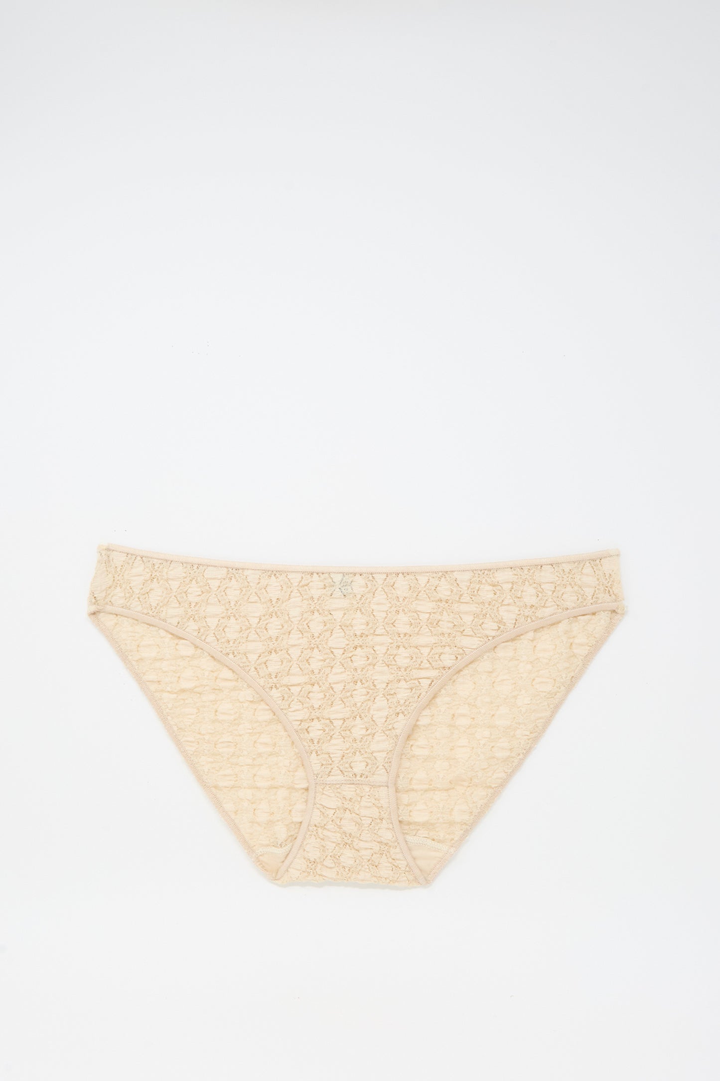 Crescent Pants in Dylan Beige by Baserange, a women's cotton lace brief made in Portugal, shown laid flat on a white background.