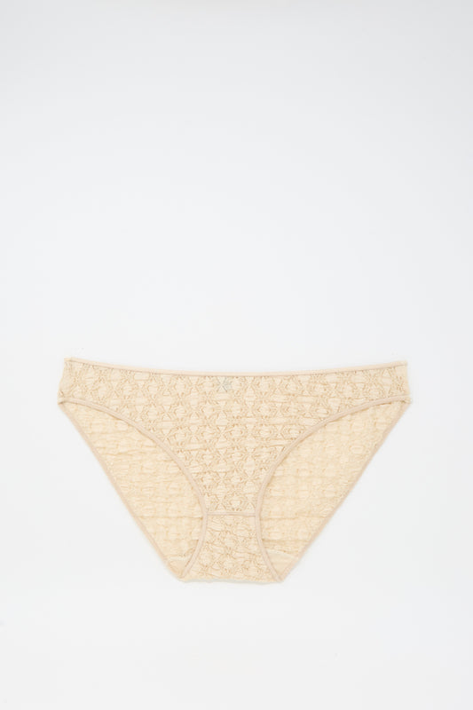 Crescent Pants in Dylan Beige by Baserange, a women's cotton lace brief made in Portugal, shown laid flat on a white background.