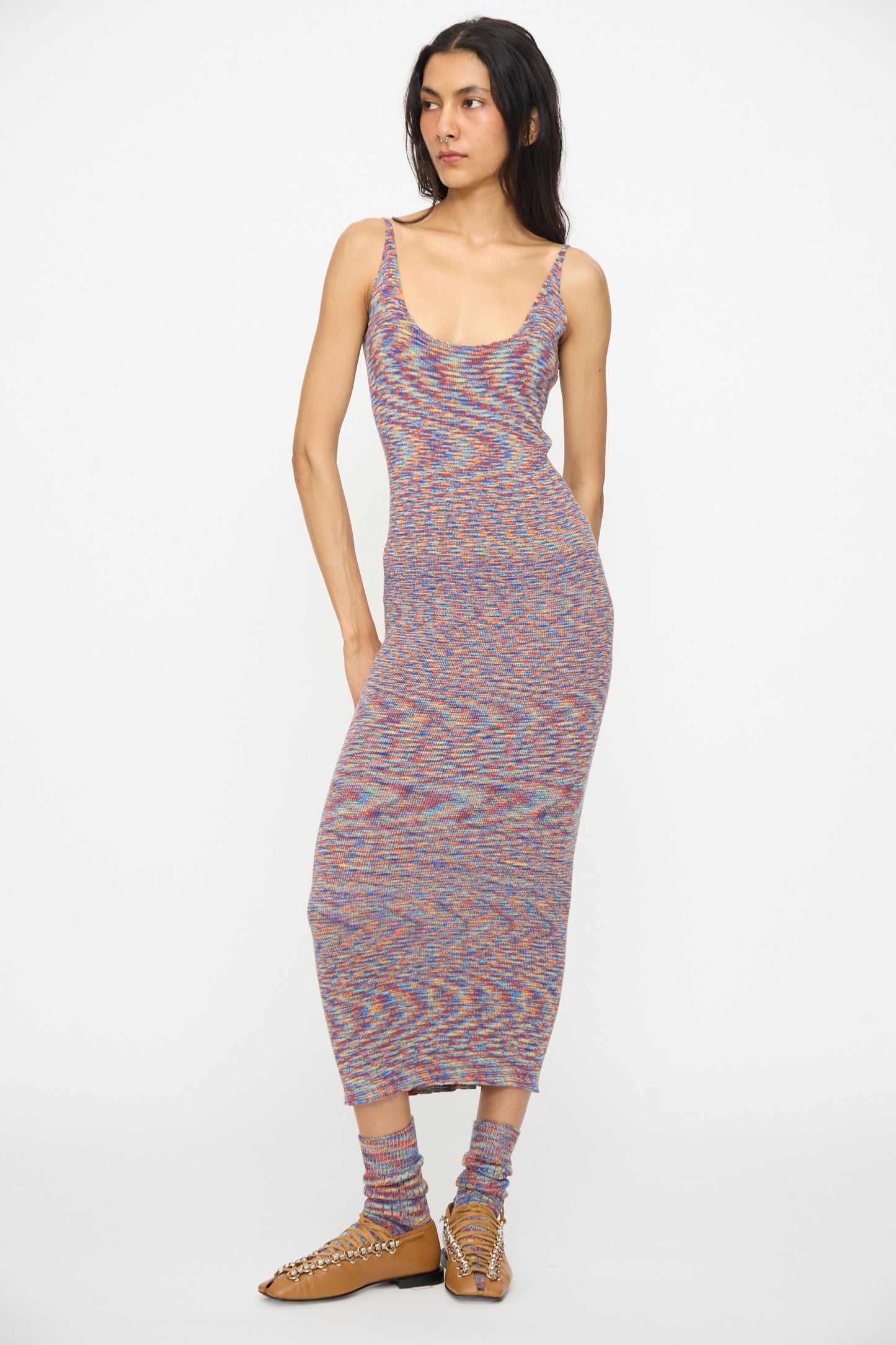 A person wears the Baserange Flute Dress in Multicolored, paired with matching socks and tan woven flats, standing against a plain white background.