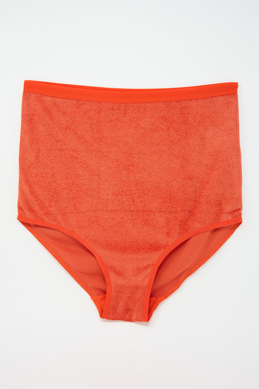 A pair of Highwaist Bell Pant in Mino Red by Baserange displayed against a white background.