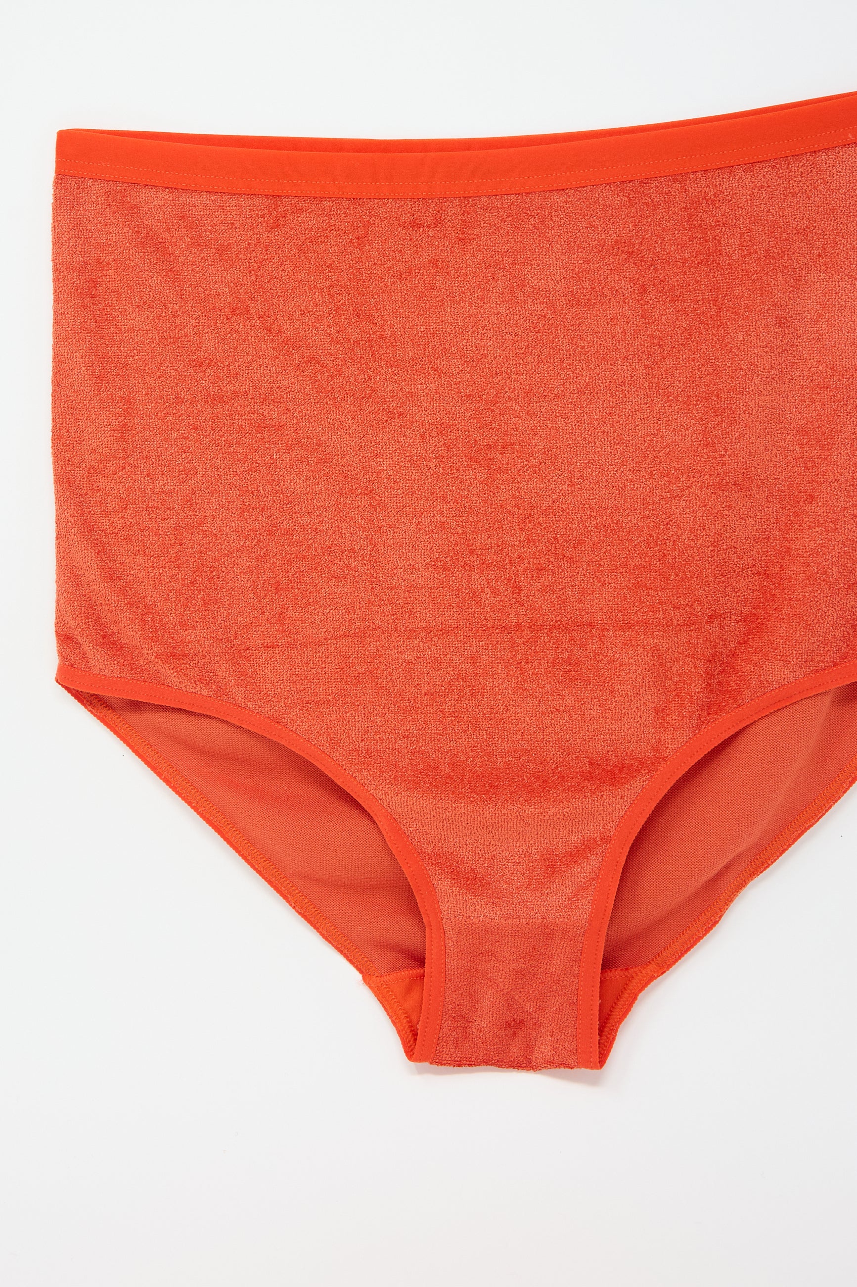 A pair of Highwaist Bell Pant in Mino Red by Baserange, displayed on a plain white background.