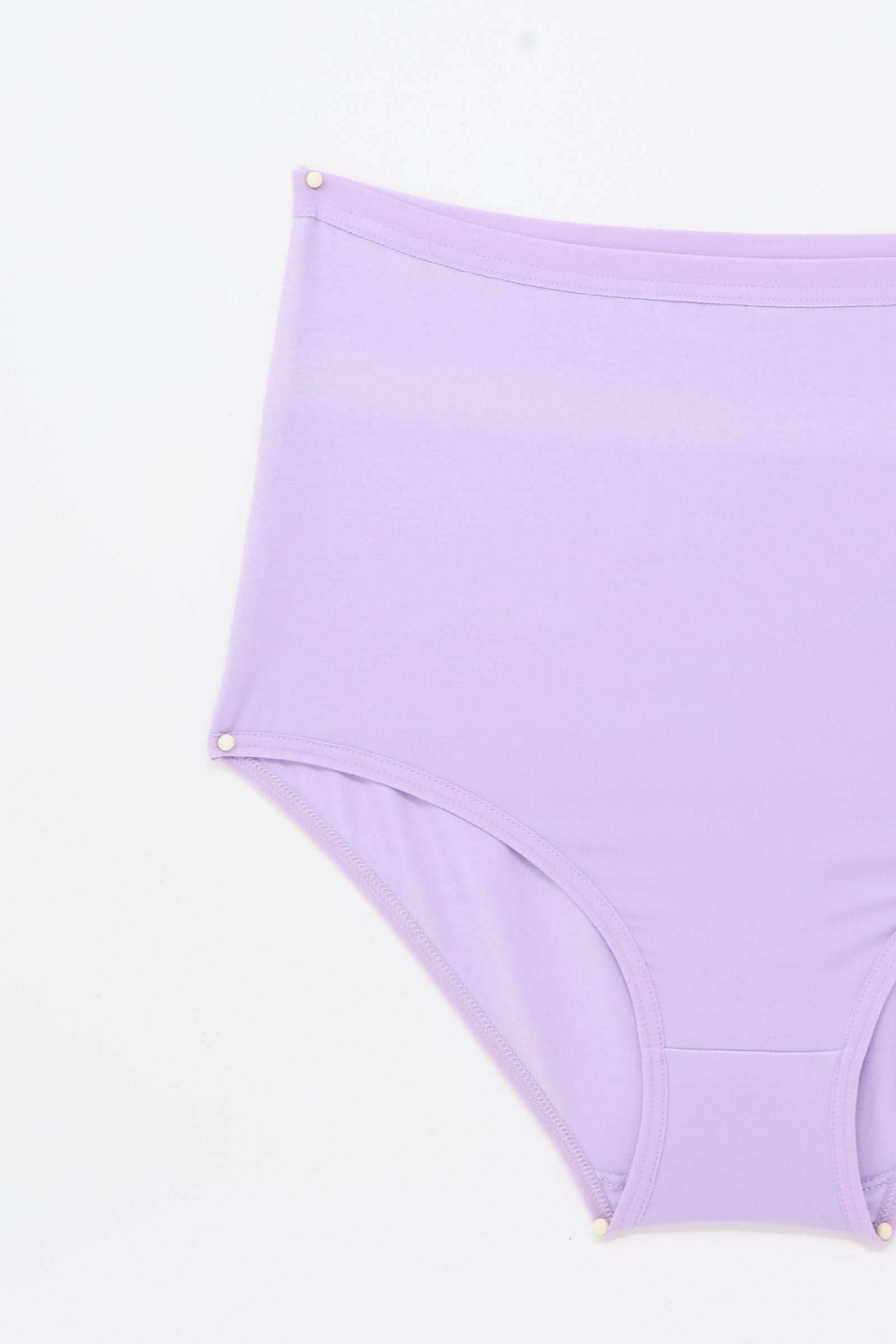 Highwaist Bell Pants in One Purple by Baserange, crafted from bamboo lyocell, photographed from the front and partially from the left side against a white background.