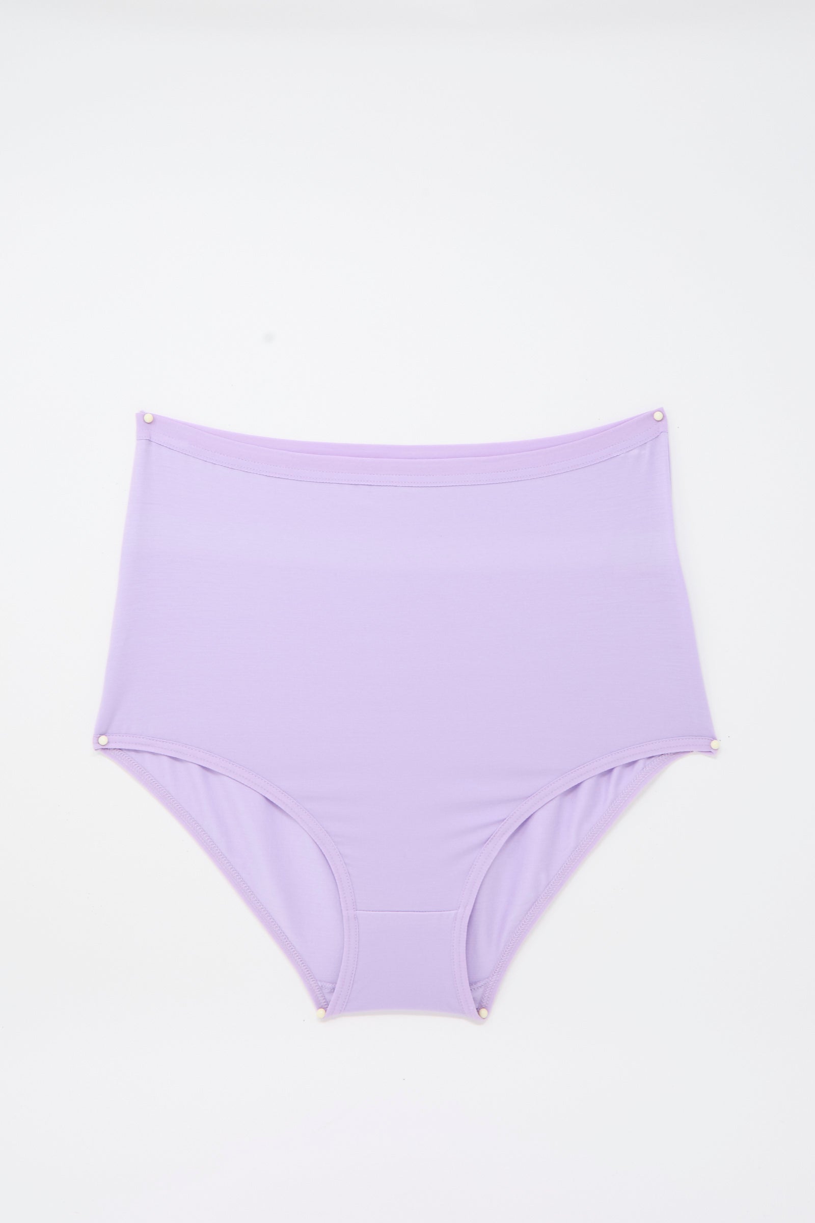 Highwaist Bell Pants in One Purple by Baserange, high-waisted lavender underwear crafted from soft, breathable bamboo lyocell, are shown laid flat on a white background with small pins securing the corners for display—offering eco-friendly comfort in a stylish high-rise silhouette.