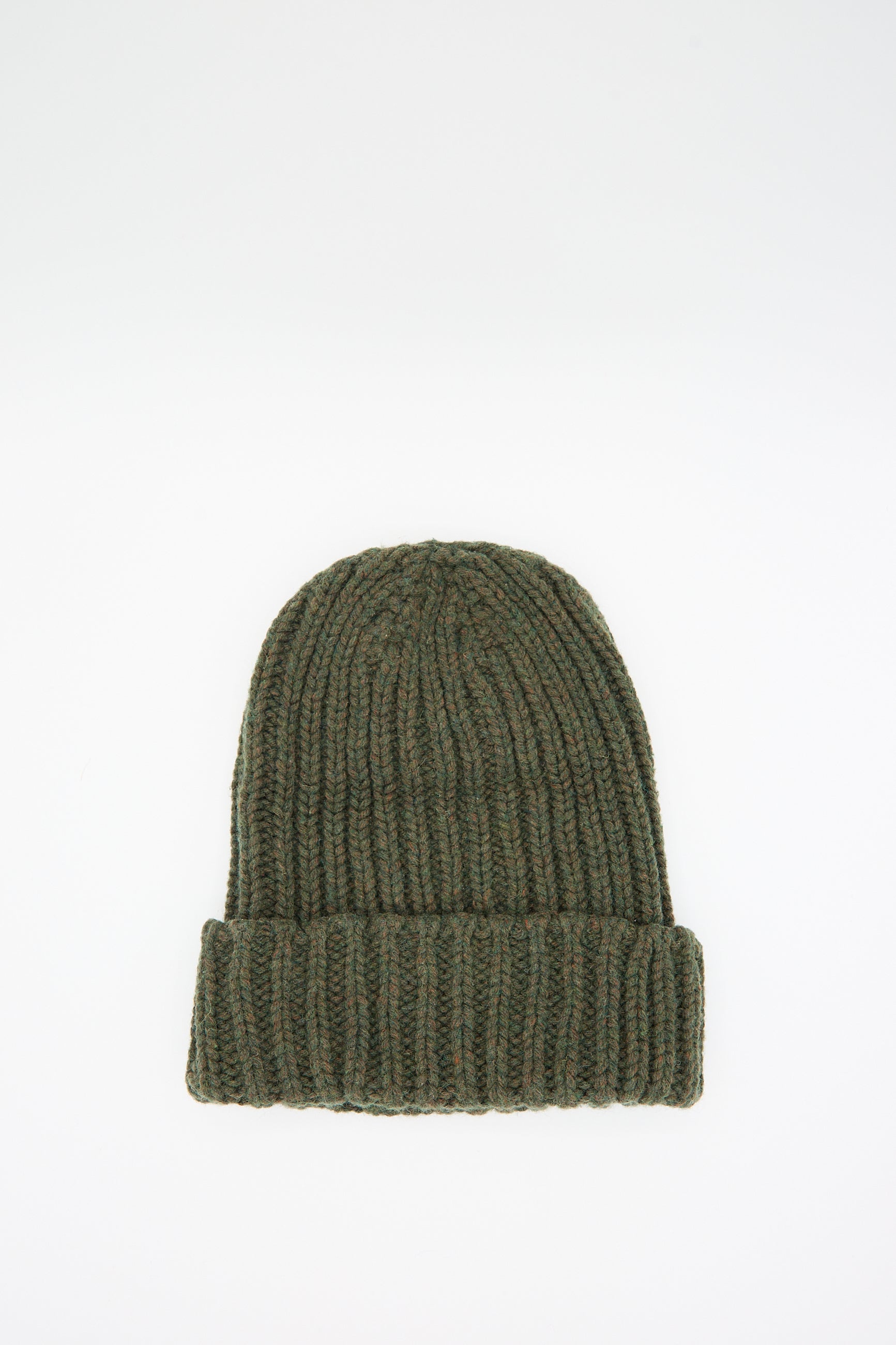 The Mea Beanie in Foret by Baserange, a green knitted oversized beanie featuring a chunky ribbed pattern and a folded cuff, made from recycled wool, is displayed laid flat on a white background.