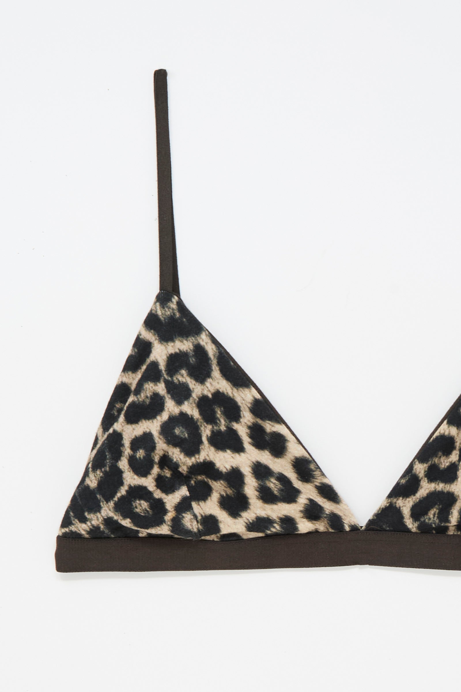 The Baserange Mississippi Bra in Leopard features a modern triangle silhouette with thin black straps, showcased against a white background. Combining style and comfort, this chic bra offers dependable support with its distinctive leopard print design.