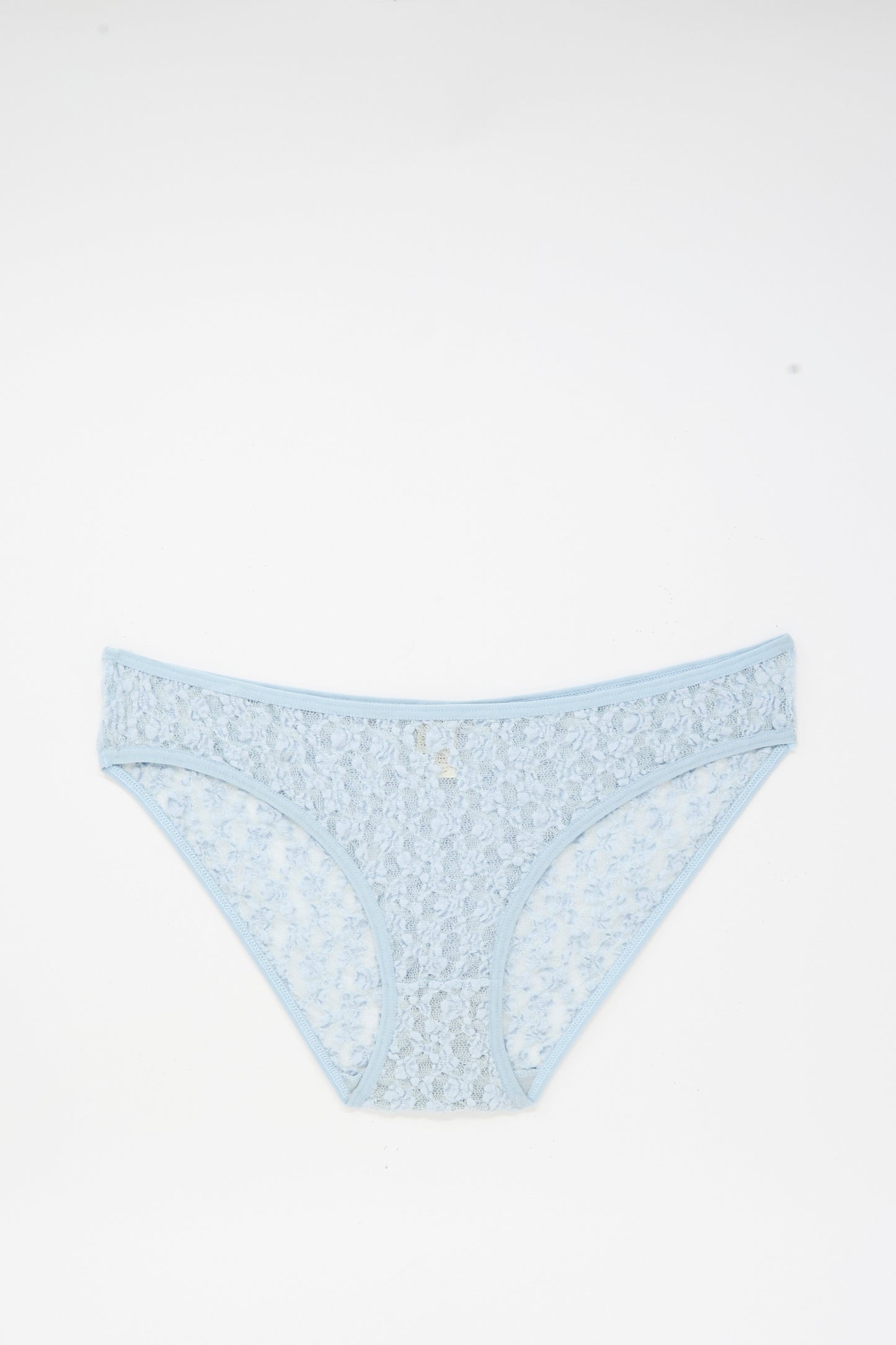 Musial Pant in Dona Blue by Baserange—light blue, low-rise underpants featuring a delicate floral lace pattern, crafted from organic cotton in Portugal, shown flat on a white background.