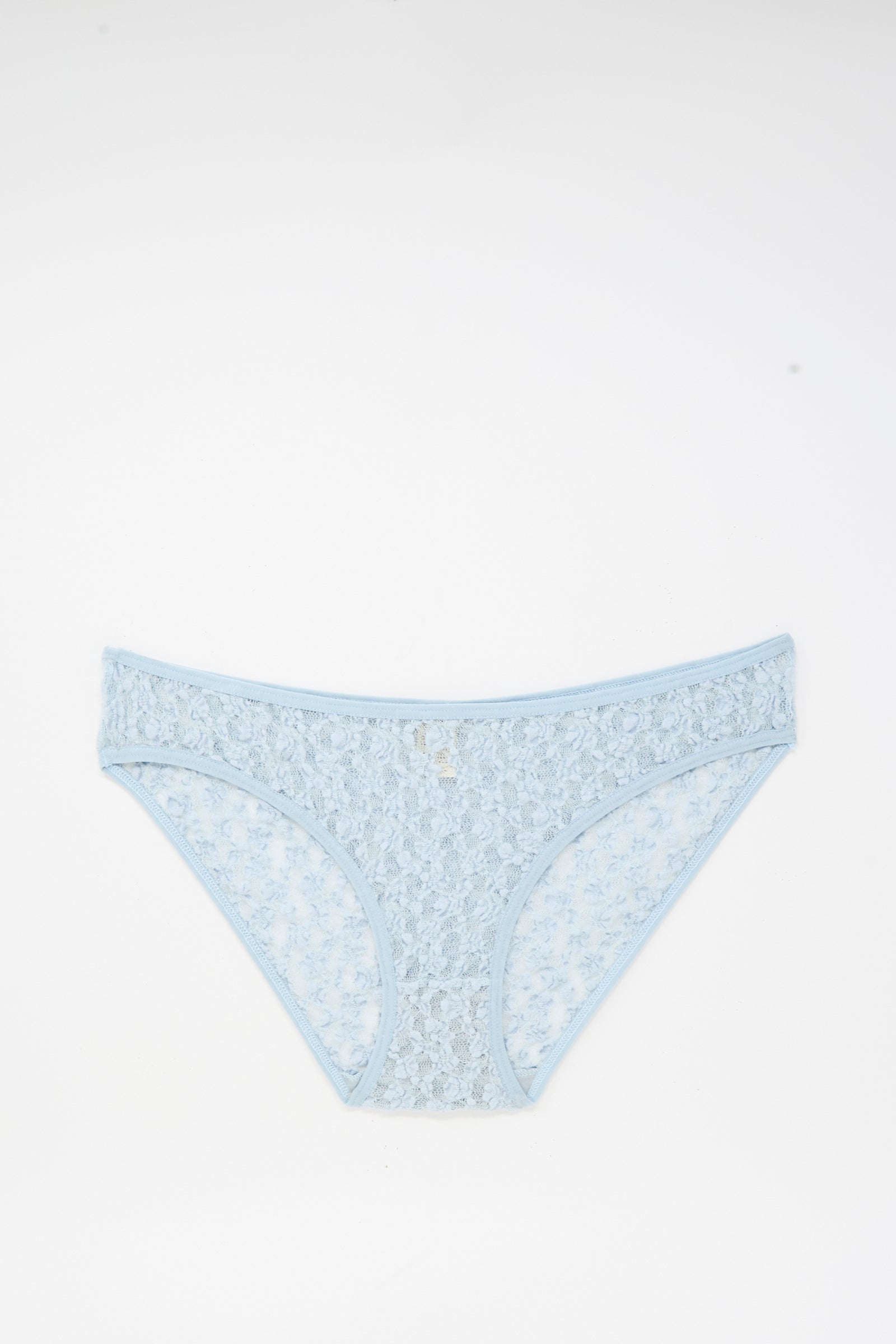 Musial Pant in Dona Blue by Baserange—light blue, low-rise underpants featuring a delicate floral lace pattern, crafted from organic cotton in Portugal, shown flat on a white background.