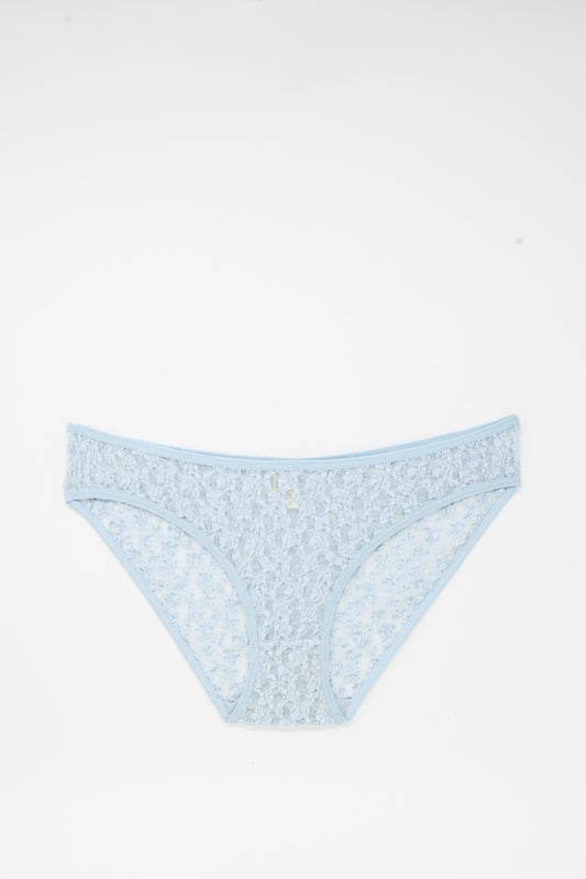 Musial Pant in Dona Blue by Baserange—light blue, low-rise underpants featuring a delicate floral lace pattern, crafted from organic cotton in Portugal, shown flat on a white background.