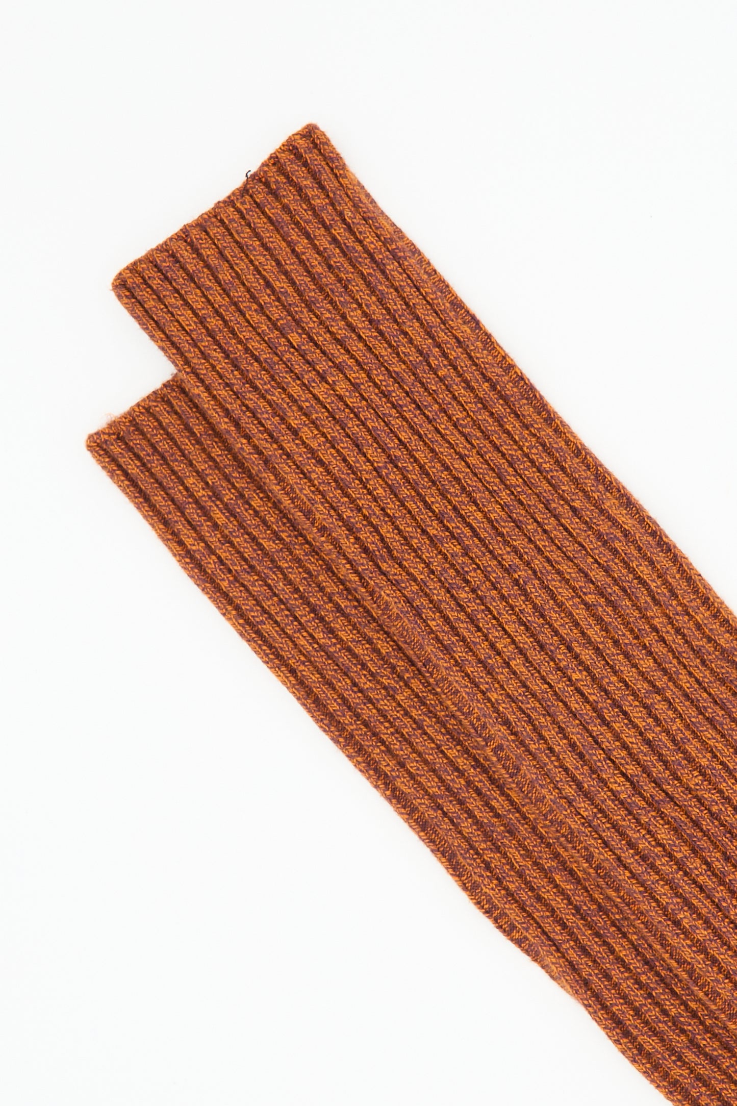 Close-up of a ribbed, brown, knitted fingerless glove with a thumb opening, displayed on a white background, reminiscent of the cozy texture found in Baserange's Overknee Sock in Angle Burgundy and Rust.