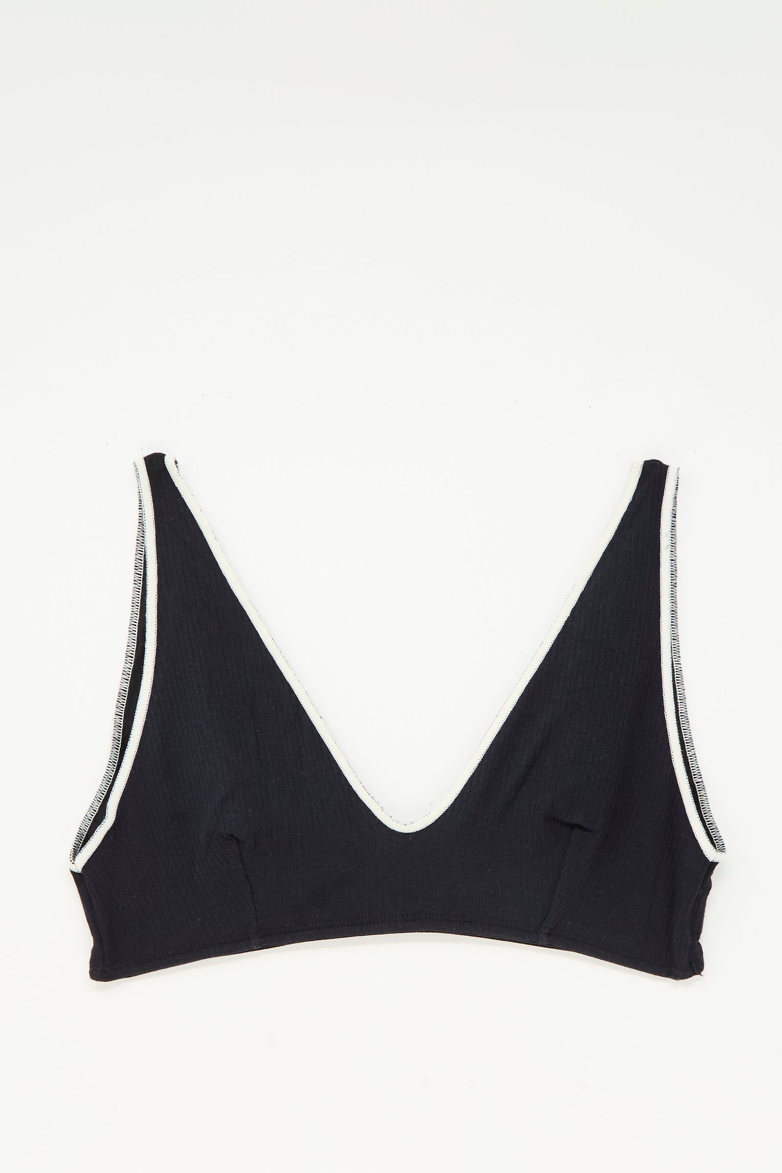 The Baserange Pam Bra in Murano Navy, featuring a v-neck and white trim, is shown laid flat on a white background.