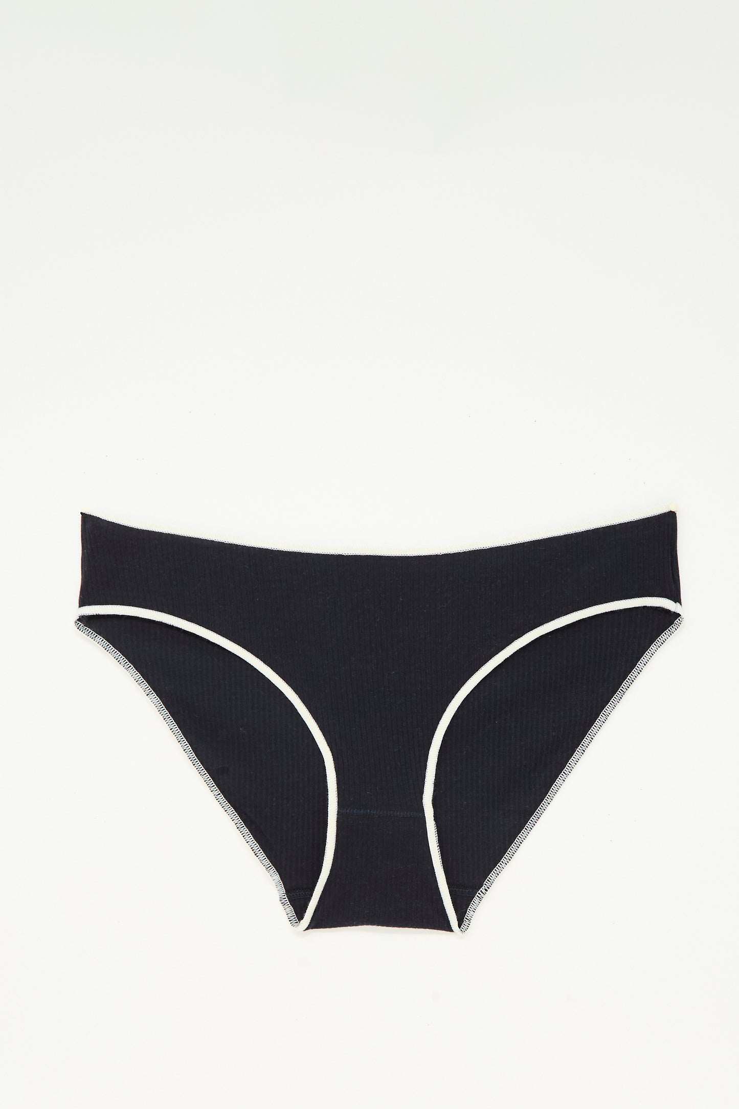 The Baserange Pam Pant in Murano Navy, a pair of low-rise briefs made from ribbed organic cotton in Portugal, is shown laid flat on a white background.