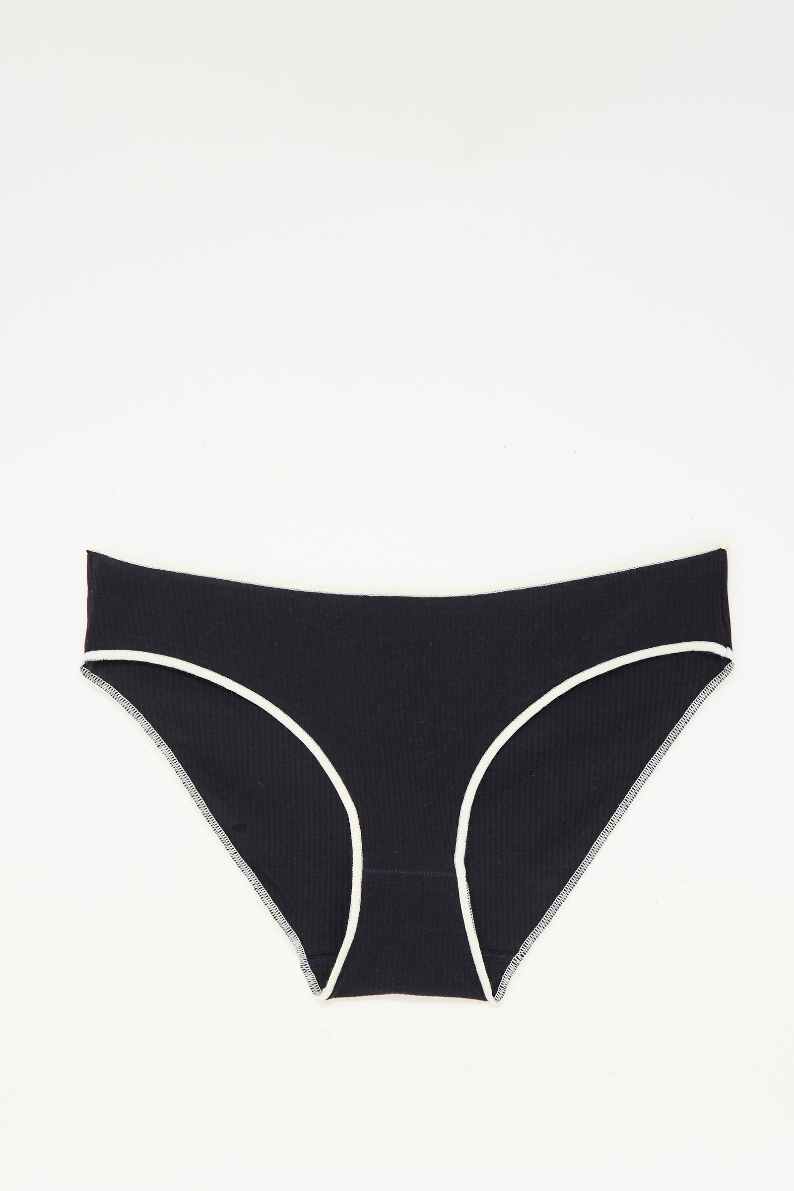 The Baserange Pam Pant in Murano Navy, a pair of low-rise briefs made from ribbed organic cotton in Portugal, is shown laid flat on a white background.