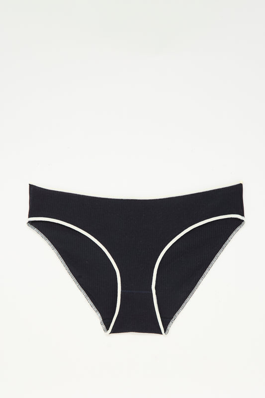 The Baserange Pam Pant in Murano Navy, a pair of low-rise briefs made from ribbed organic cotton in Portugal, is shown laid flat on a white background.