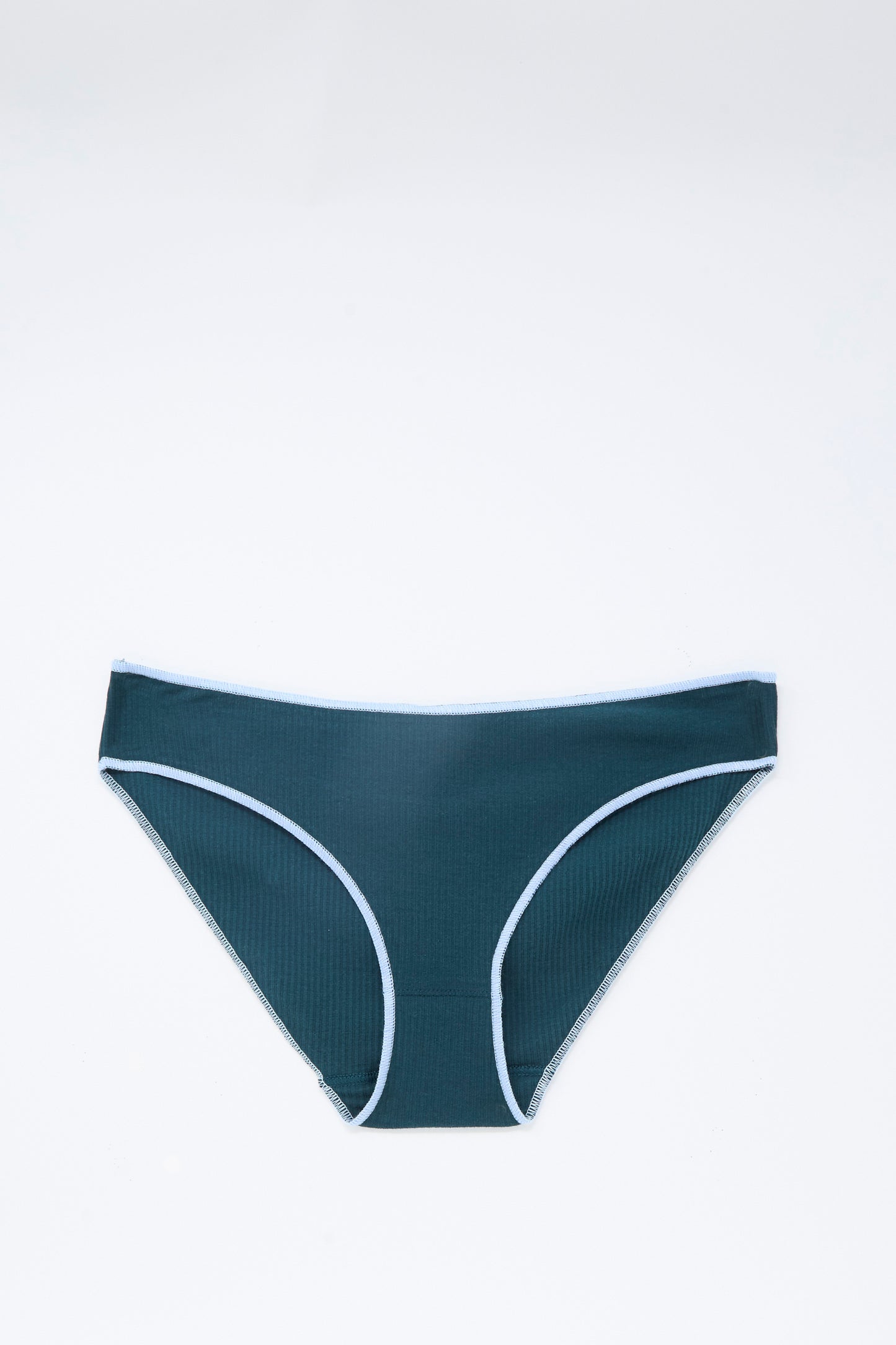 The Baserange Pam Pants in Hirsu Green are a pair of low-rise, brief bikini-style underwear featuring a dark green hue with light blue trim and an elastic waistband. Crafted from soft cotton rib fabric, they are shown laid flat against a plain white background.