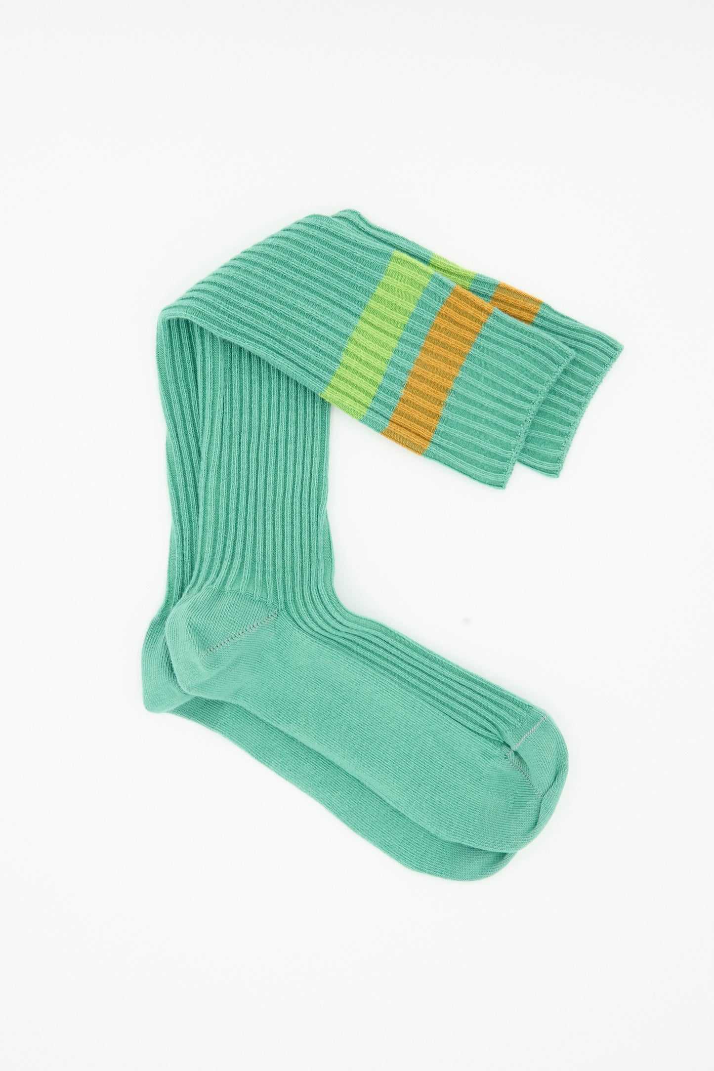 A pair of Baserange Race Knee Socks in Orbit Green, crafted in France from premium cotton rib, with one sock featuring blue, yellow, and orange stripes near the top, displayed on a white background.