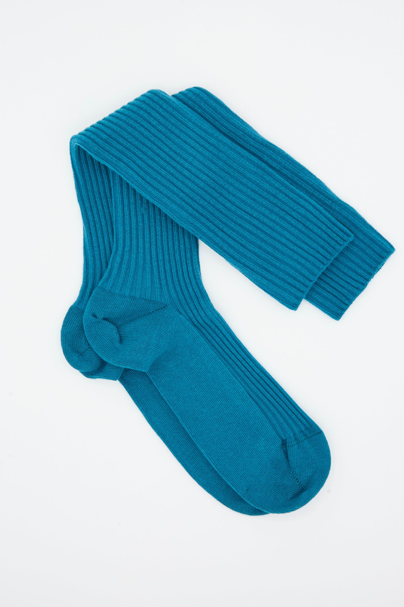 A pair of Baserange Rib Knee Socks in Sphere Blue, crafted from a soft cotton blend, laid flat on a white background.