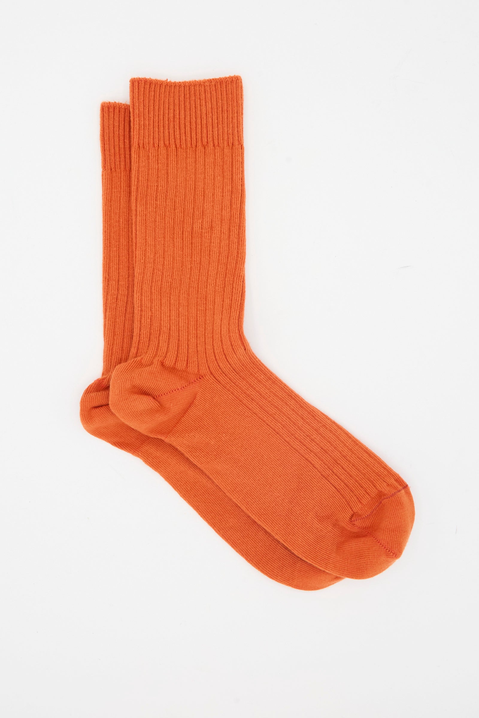 A pair of Baserange Rib Overankle Socks in Scopa Red, made in France, displayed side by side on a white background.