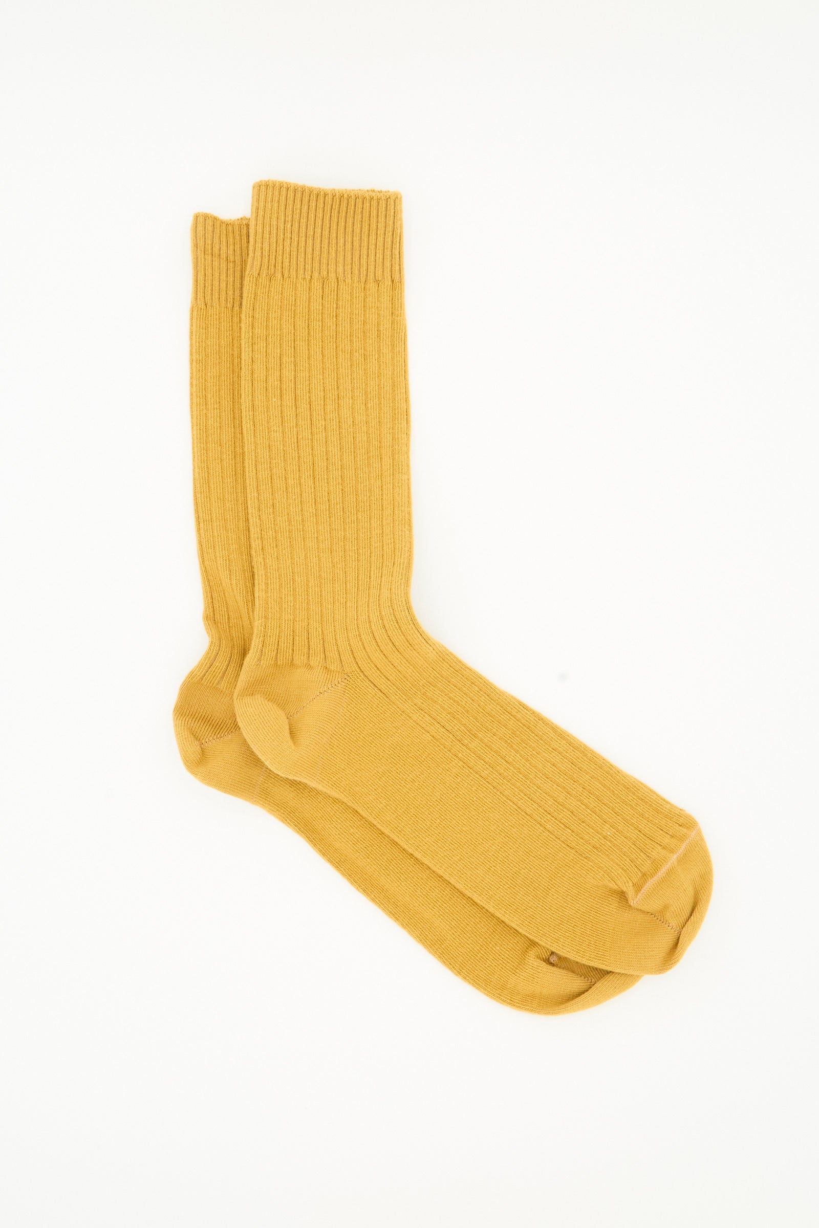 A pair of Baserange Rib Overankle Socks in Silva Brown laid flat on a white background.