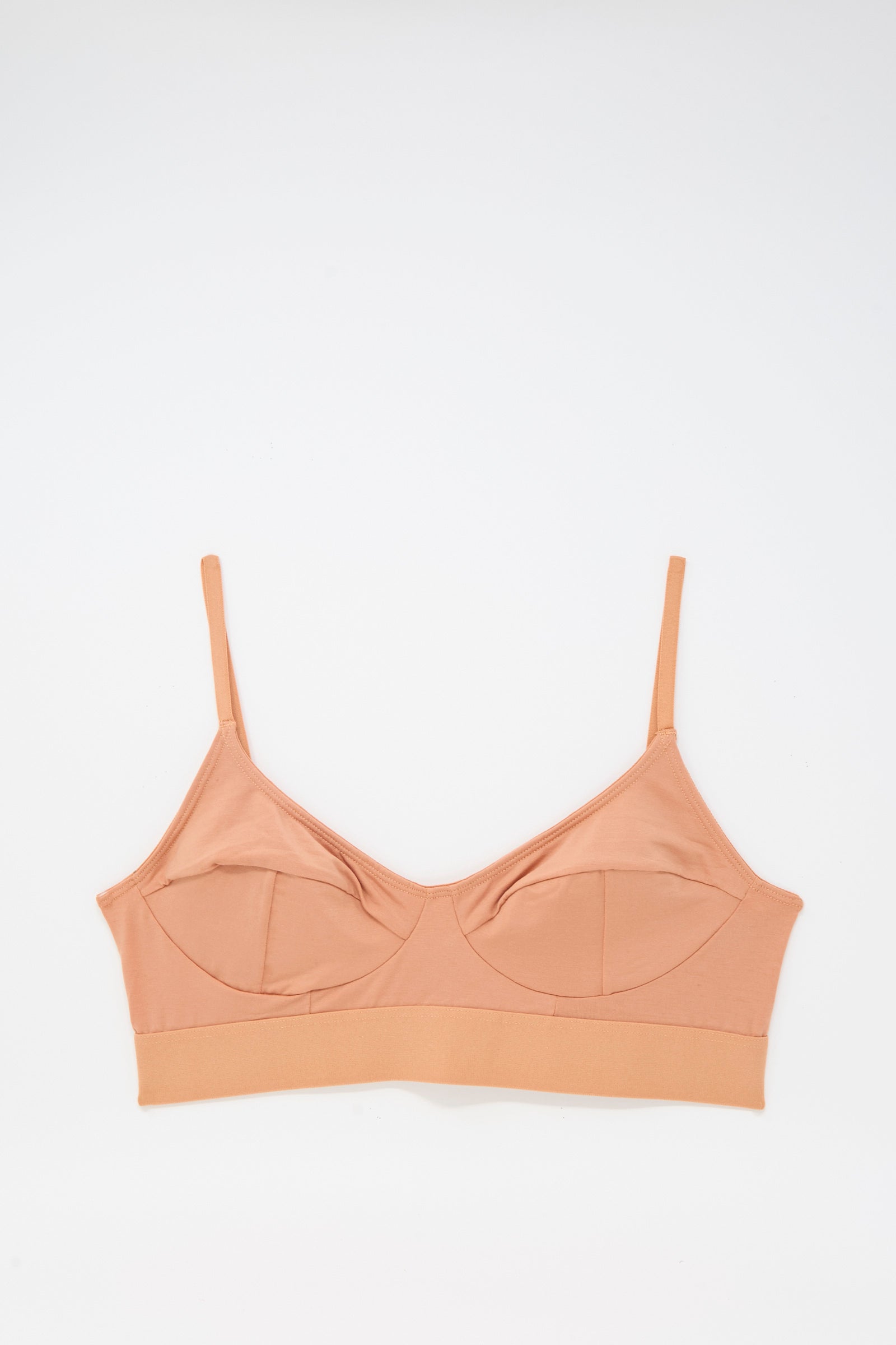 The Baserange Soft Bra in Branch Terracotta is a tan bamboo jersey bra with thin adjustable straps, wireless and supportive, shown flat on a white background.