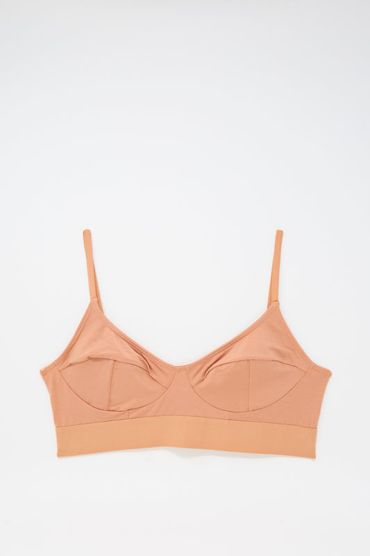 The Baserange Soft Bra in Branch Terracotta is a tan bamboo jersey bra with thin adjustable straps, wireless and supportive, shown flat on a white background.