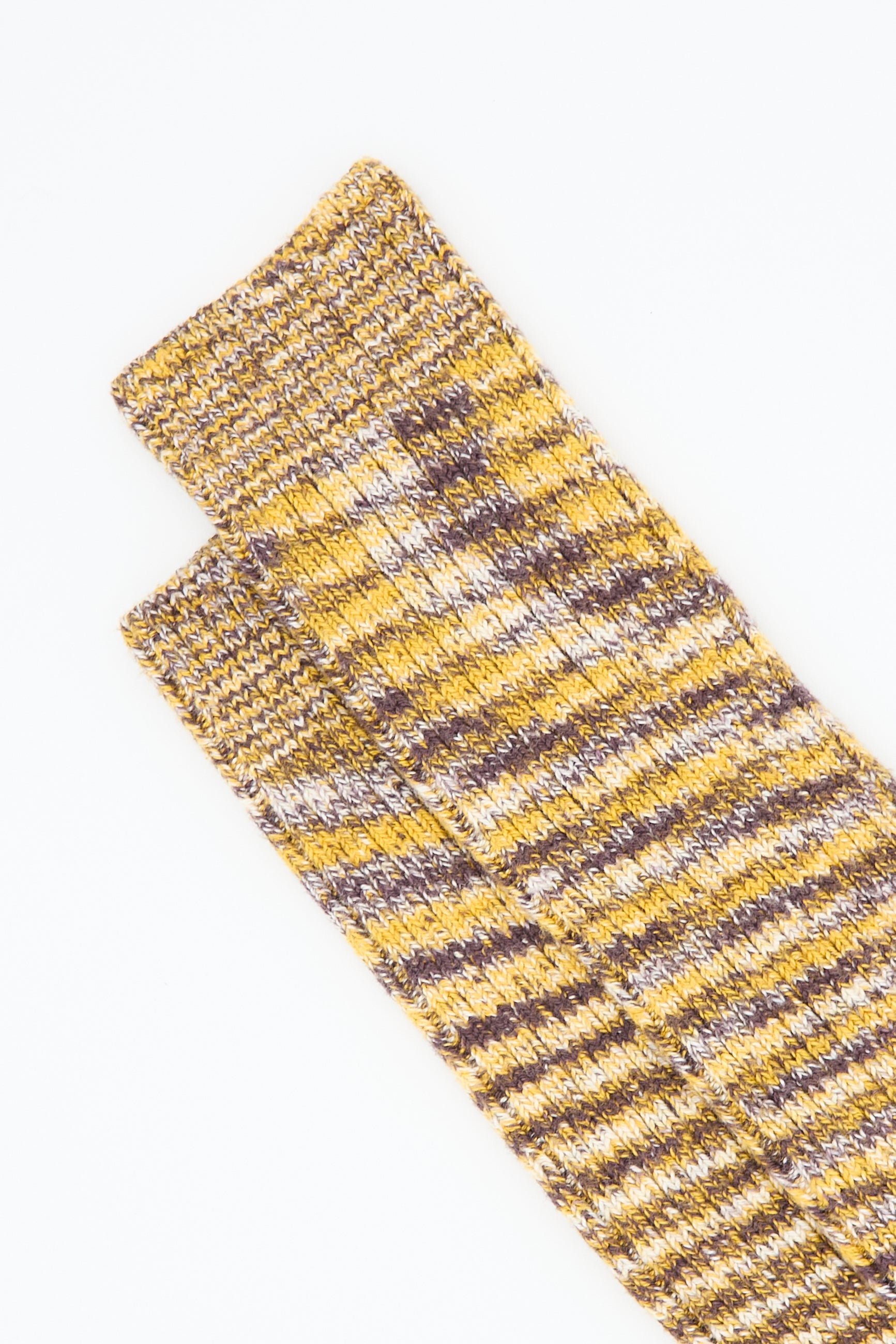 Two Twisted Overknee Socks in Brown Multicolor from Baserange are laid flat on a white surface.