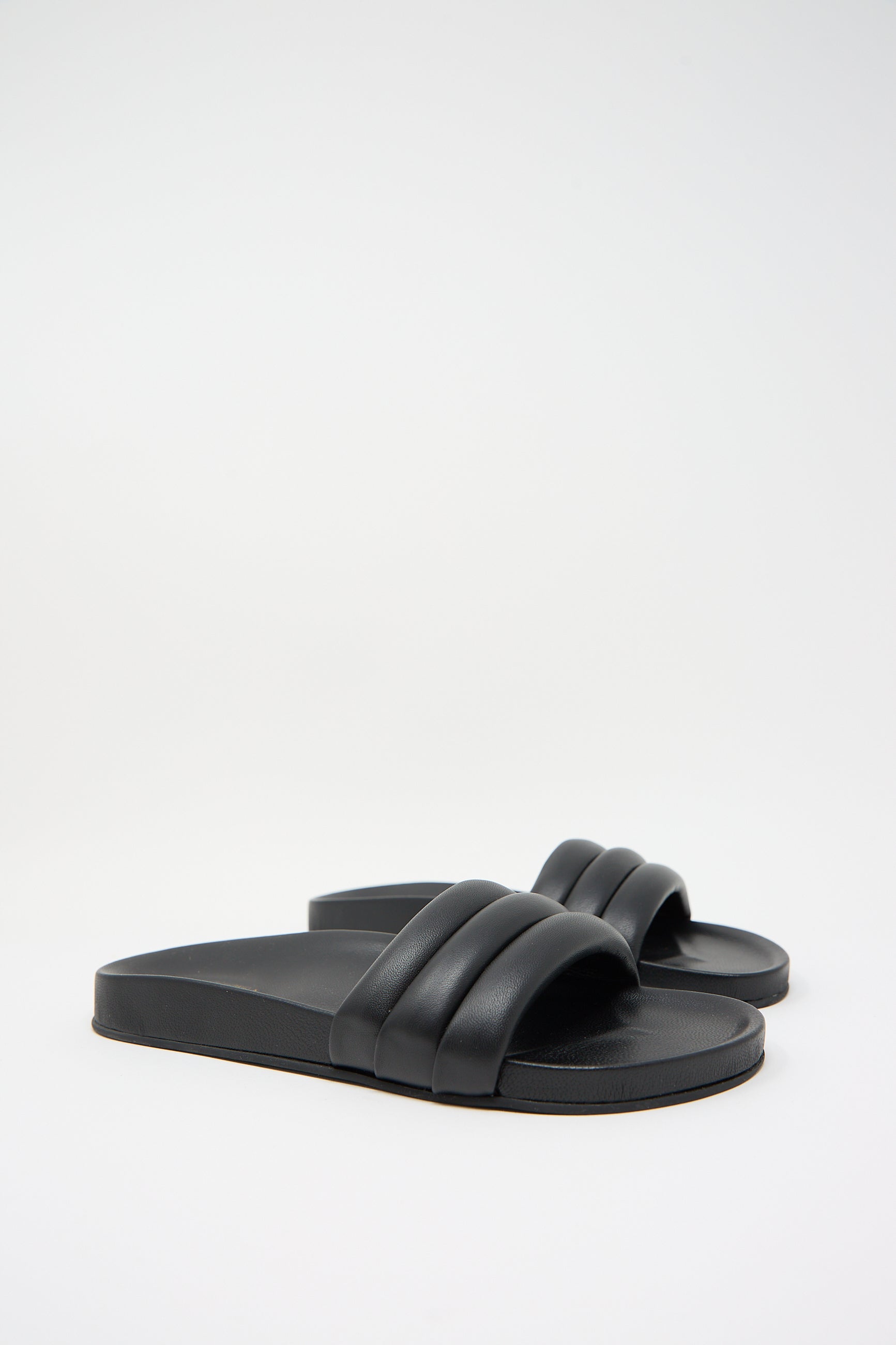 A pair of Beatrice Valenzuela Monocolor Sandalia in Black with wide leather uppers on a plain white background.