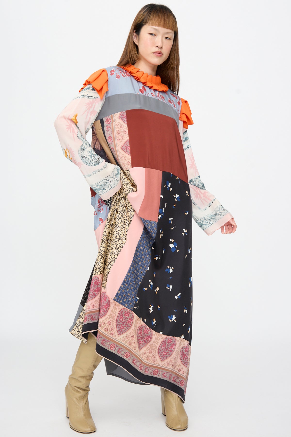 Bettina Bakdal Ruffled Collar and Shoulder Dress in Grit Kallin: a midi-length, up-cycled silk patchwork dress with a ruffled orange collar, shoulder details, and vintage floral and patterned scarves.