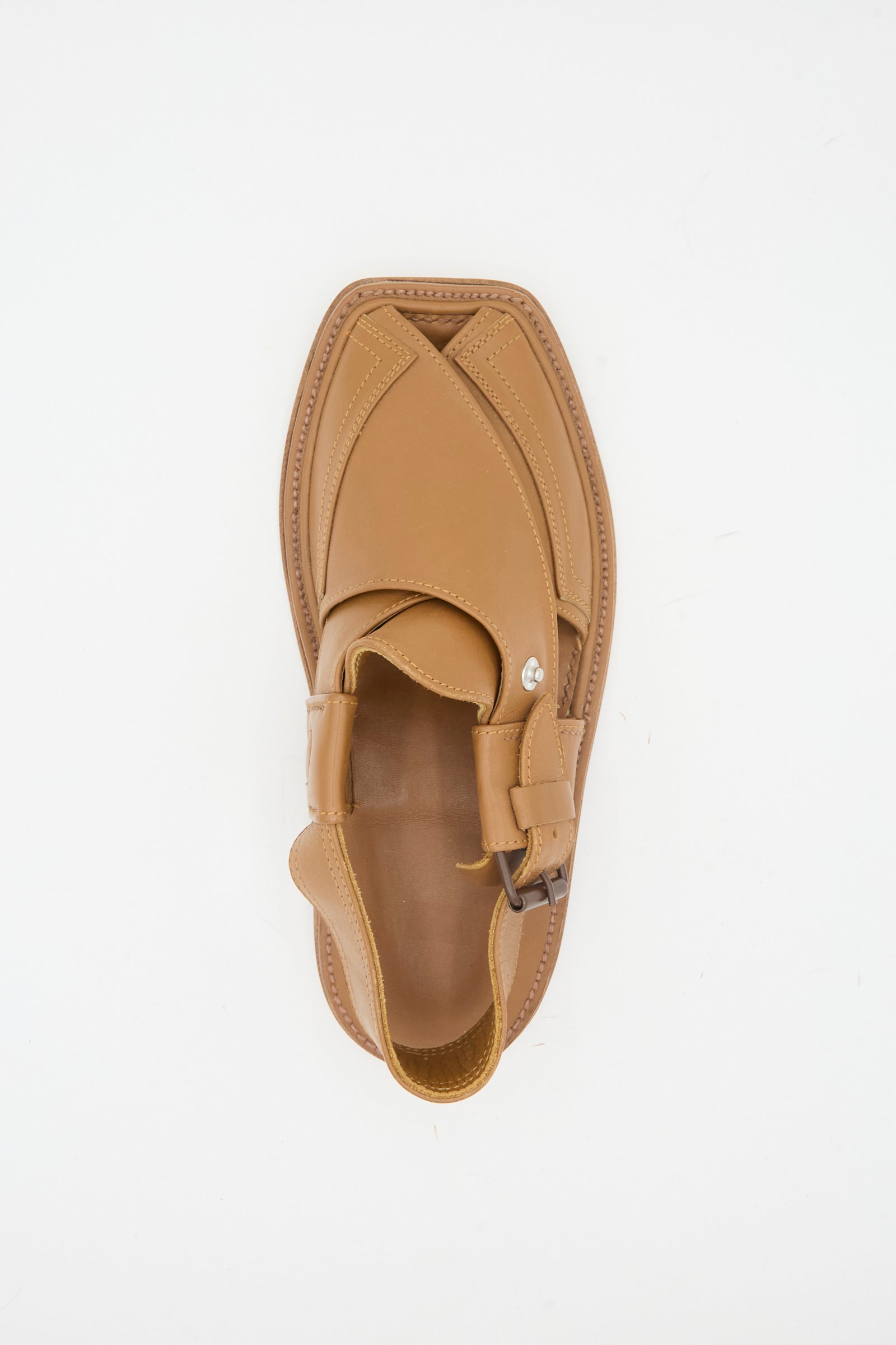 The Bless No. 08 Desertsandals in Light Brown is a single closed-toe leather sandal with a buckle strap, decorative stitching, and subtle crossover design, shown from above on a white background.