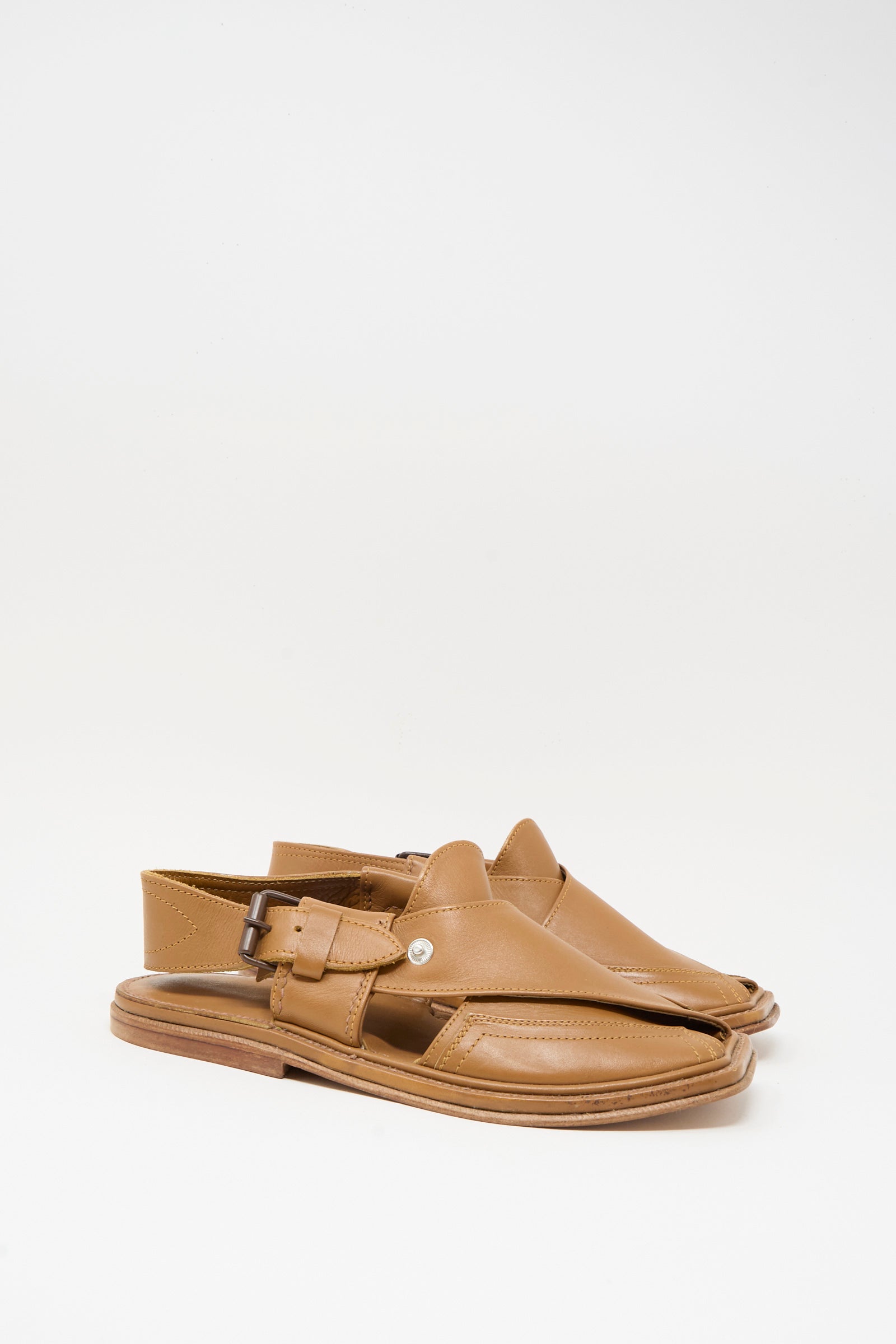 The Bless No. 08 Desertsandals in Light Brown are leather sandals with open sides, closed toes, buckled ankle straps, and a classic crossover design, displayed on a plain white background.