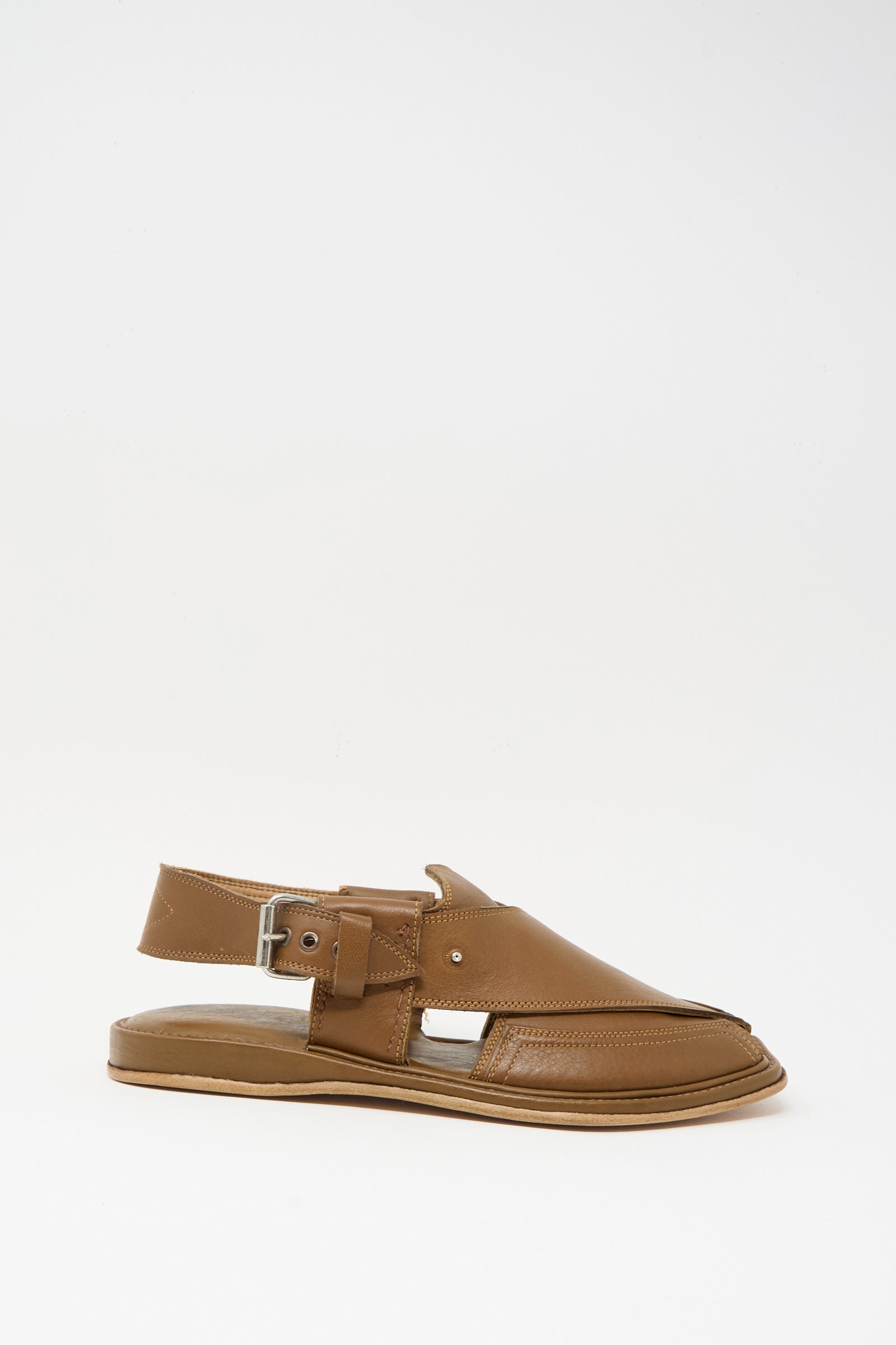 The Bless No. 08 Desertsandals in Dark Brown are French-made leather sandals with an open toe, closed sides, a slingback buckle strap, and a flat sole, shown against a plain white background.