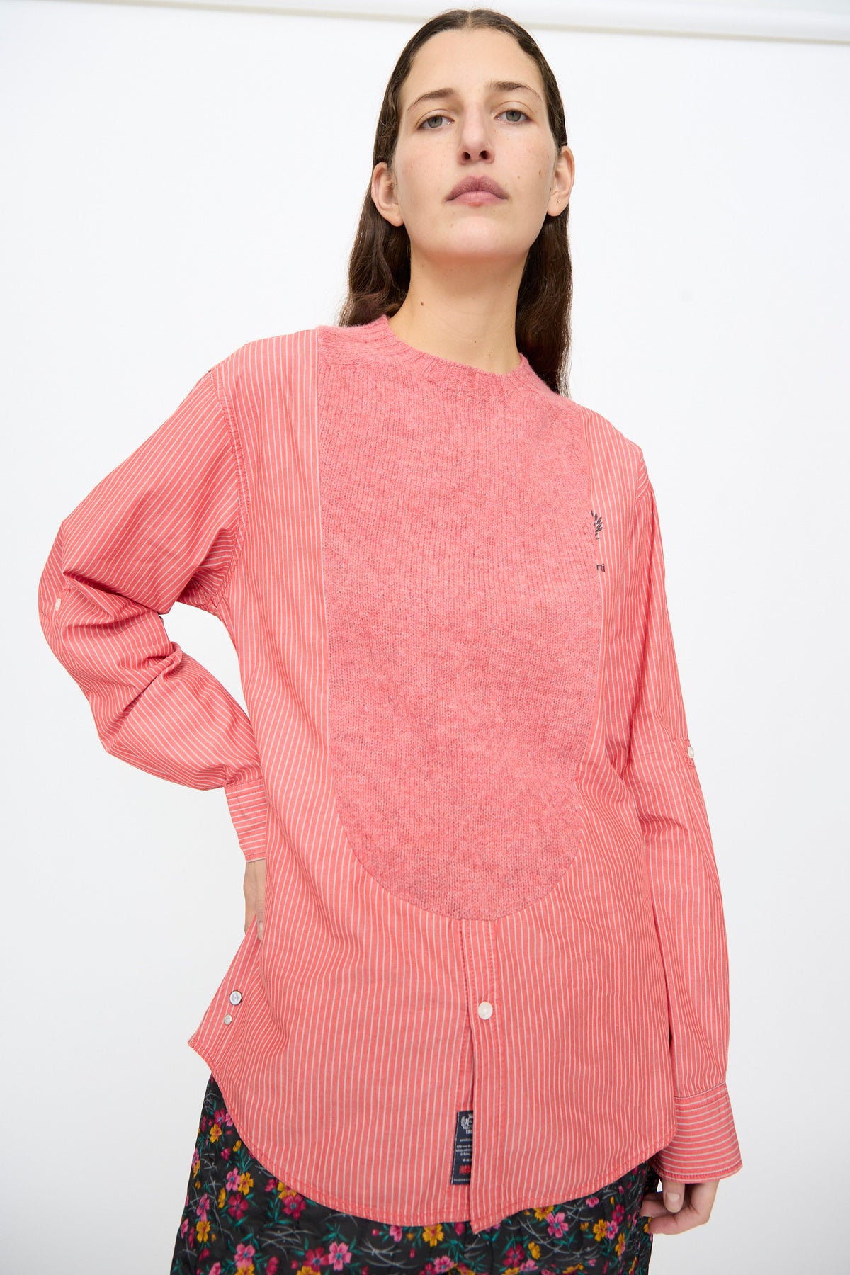A Bless No. 68 Frontinsertpullover in Unique II featuring a long-sleeved striped poplin design with a pink knit chest panel and a pink-and-white striped cotton body.